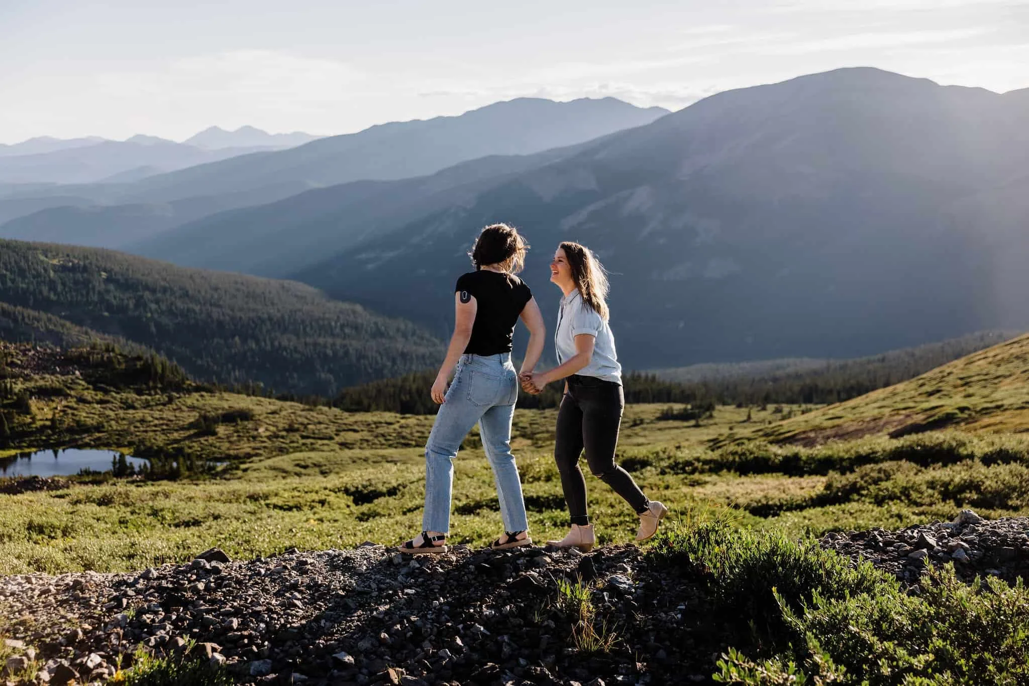A couple walk while holding hands