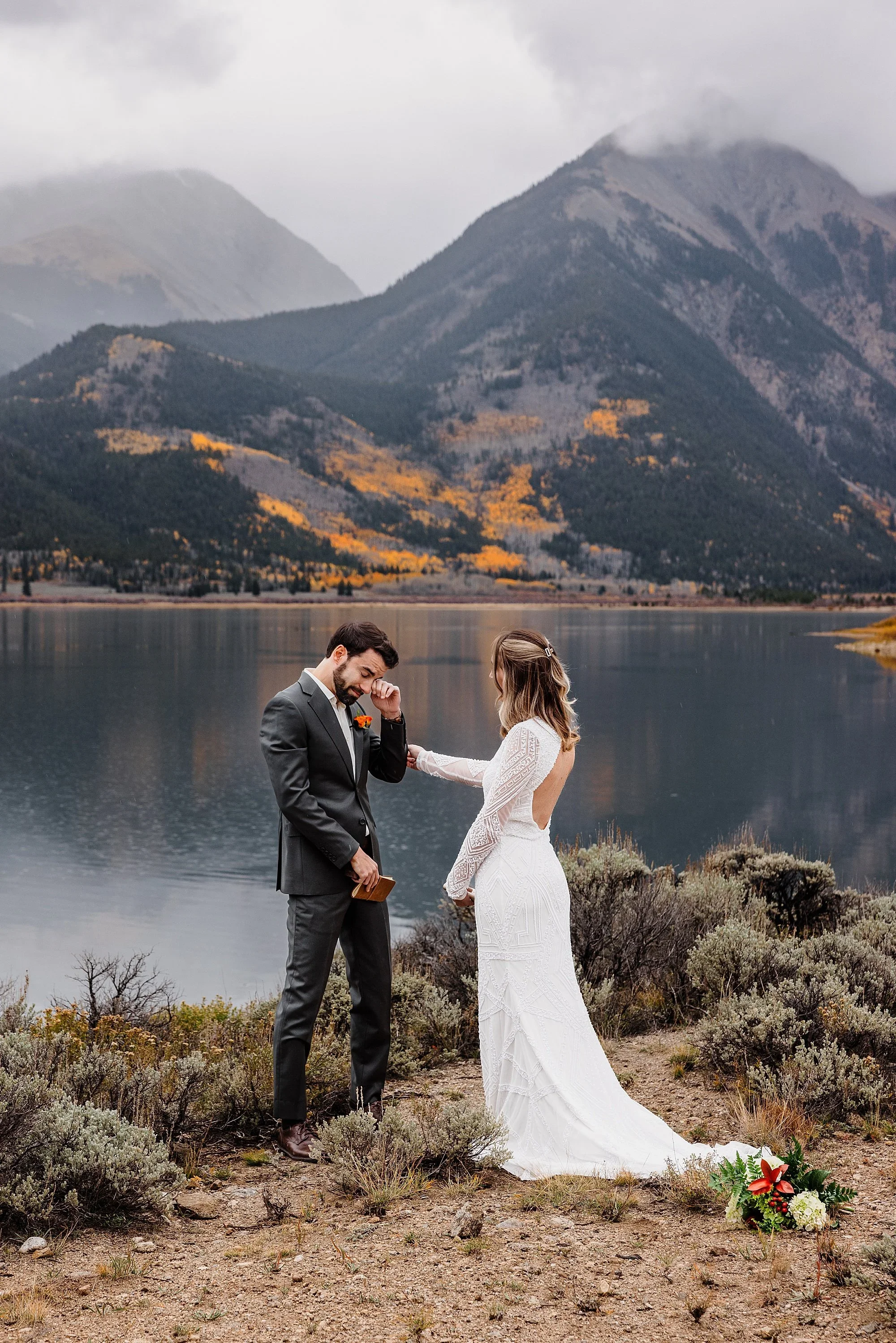Emotional elopement ceremony at a lake
