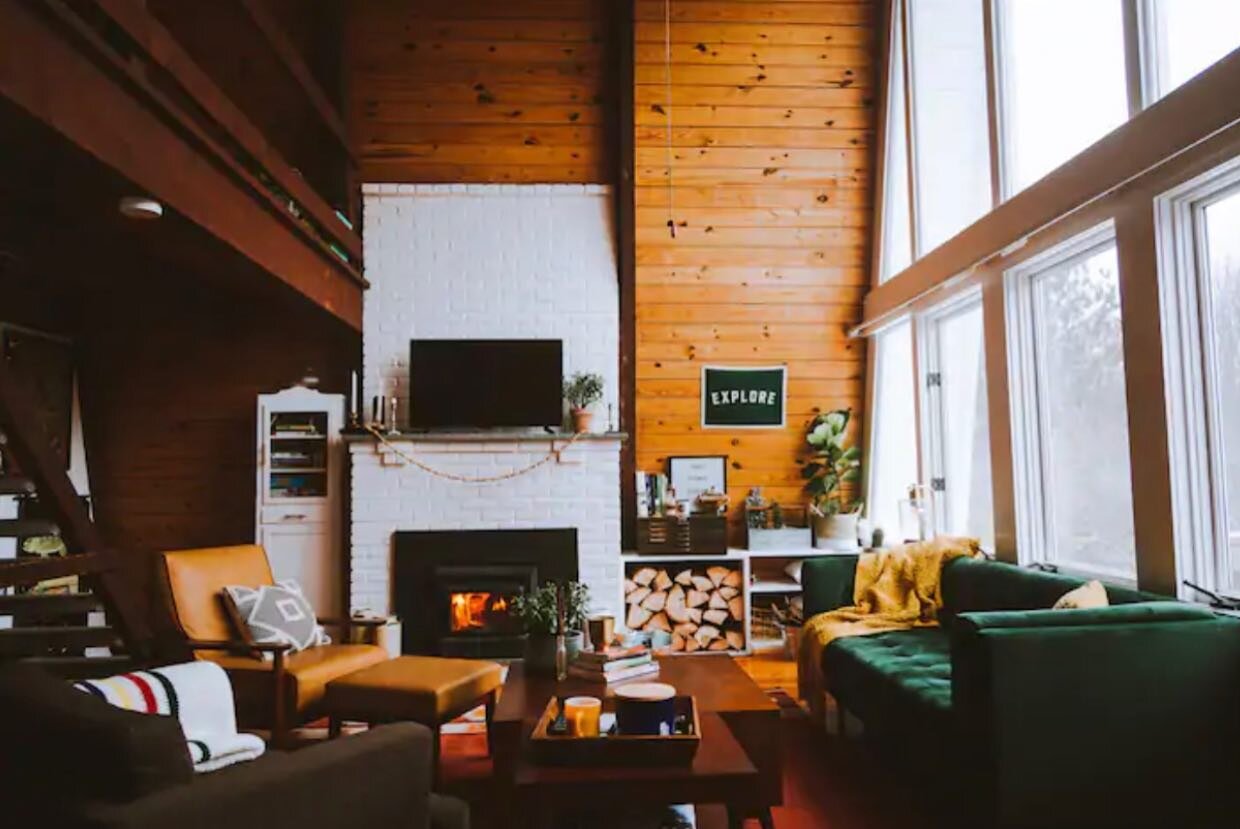 We designed our entire great room around a dark green velvet couch from @joybird. We saw this photo last year from a cabin in NY called the Poko Lodge and loved the mix of soft materials, wood, white brick and leather.