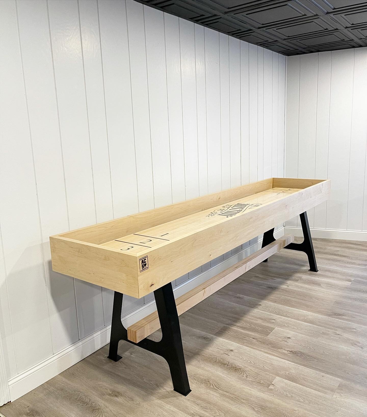 Our shuffleboard table was installed today by the team at @a_carpenters_son. It sits in our basement lounge and has some cool unique details to it! Swipe right to see!