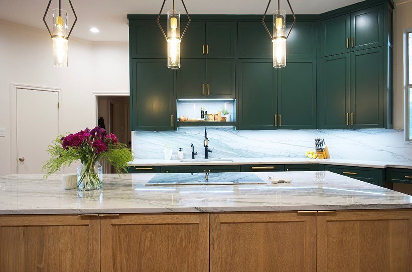 Repurposing an underused closet into an appliance niche, gave this kitchen a whole new life! The extra space created room for entertaining and a much better flow for effortless cooking! The use of deep greens and natural wood tones brought a fresh ne