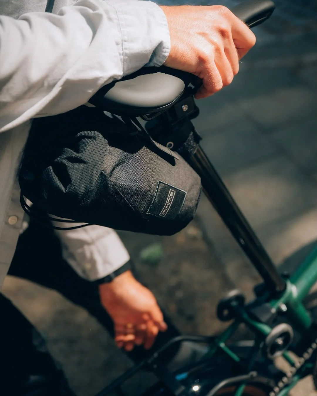 The popular Brompton Transport bag has been redesigned  for the G Line! 
It fits onto the back of the saddle and is the perfect accessory  for when you need to,

-Cover your bike on public transport
-Put your bike in the boot of a car while having it