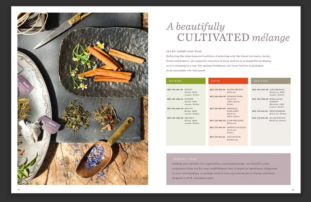 A Beautifully Cultivated Melange spread with raw tea ingredients on trays and stone slate.