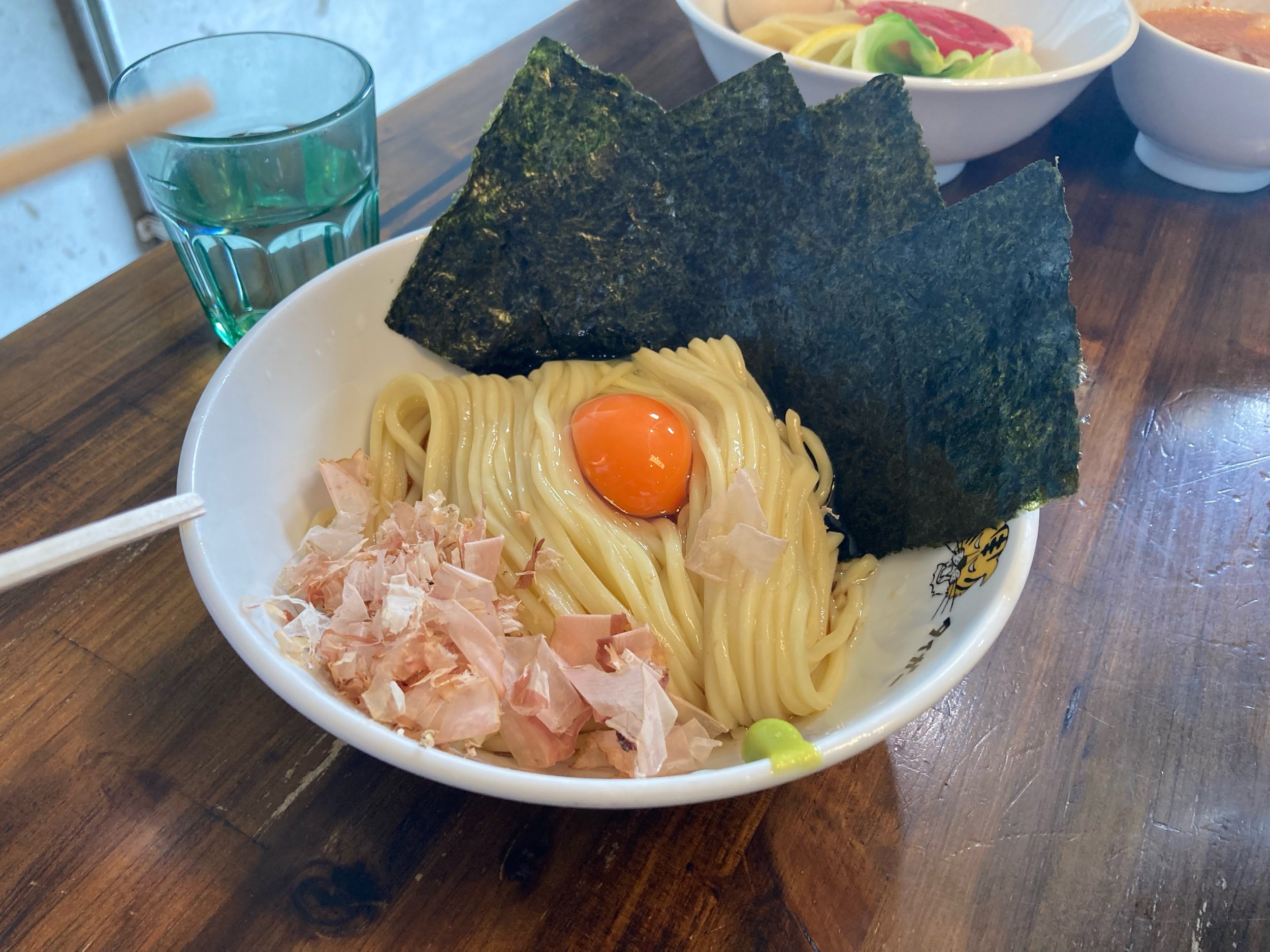 The “TKM” Tamagokakemen at Golden Tiger. The noodles sit on top of a tare seasoning sauce.