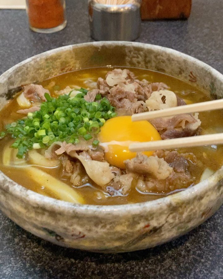 Curry udon at Tsurumaru in Takamatsu, extra raw egg topping.
Tsurumaru is one of the legendary udon shops of Takamatsu in Kagawa prefecture. The whole area is really all about udon, or &ldquo;Sanuki udon&rdquo; to be more precise. 
Tsurumaru is best 