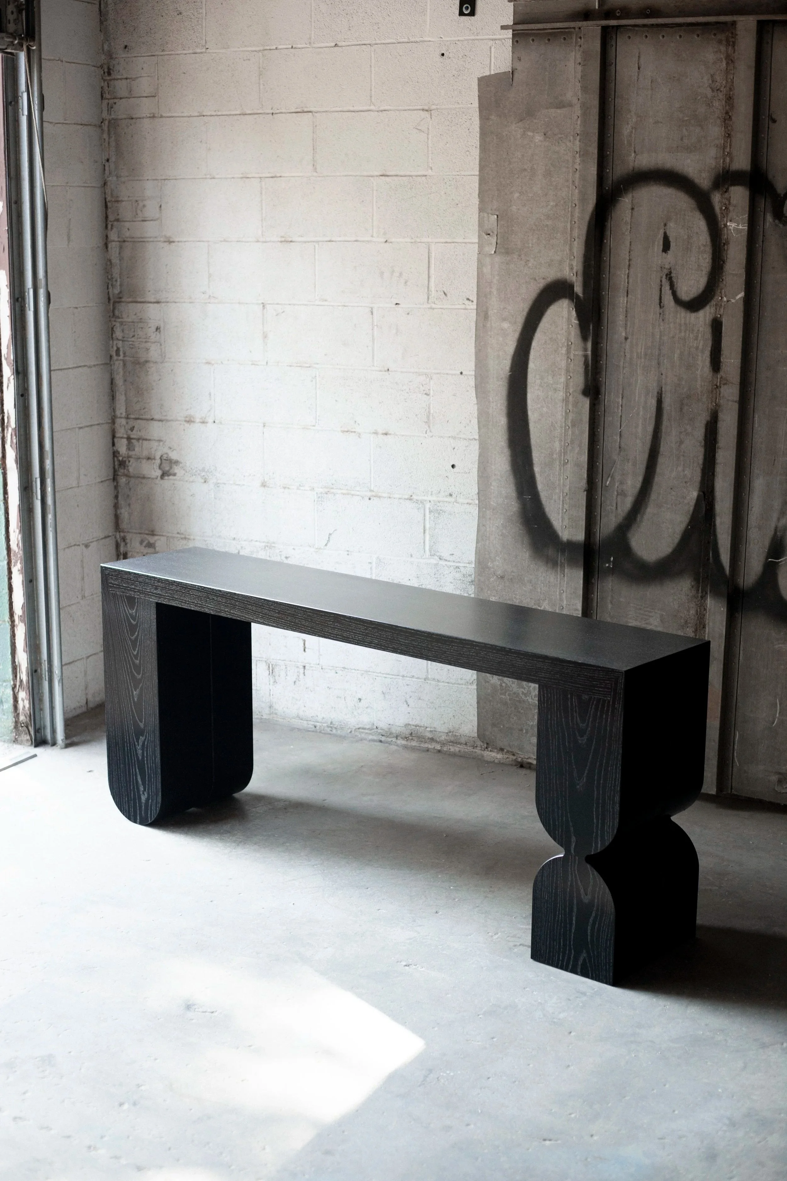 blackened ash modern console table with art deco feet