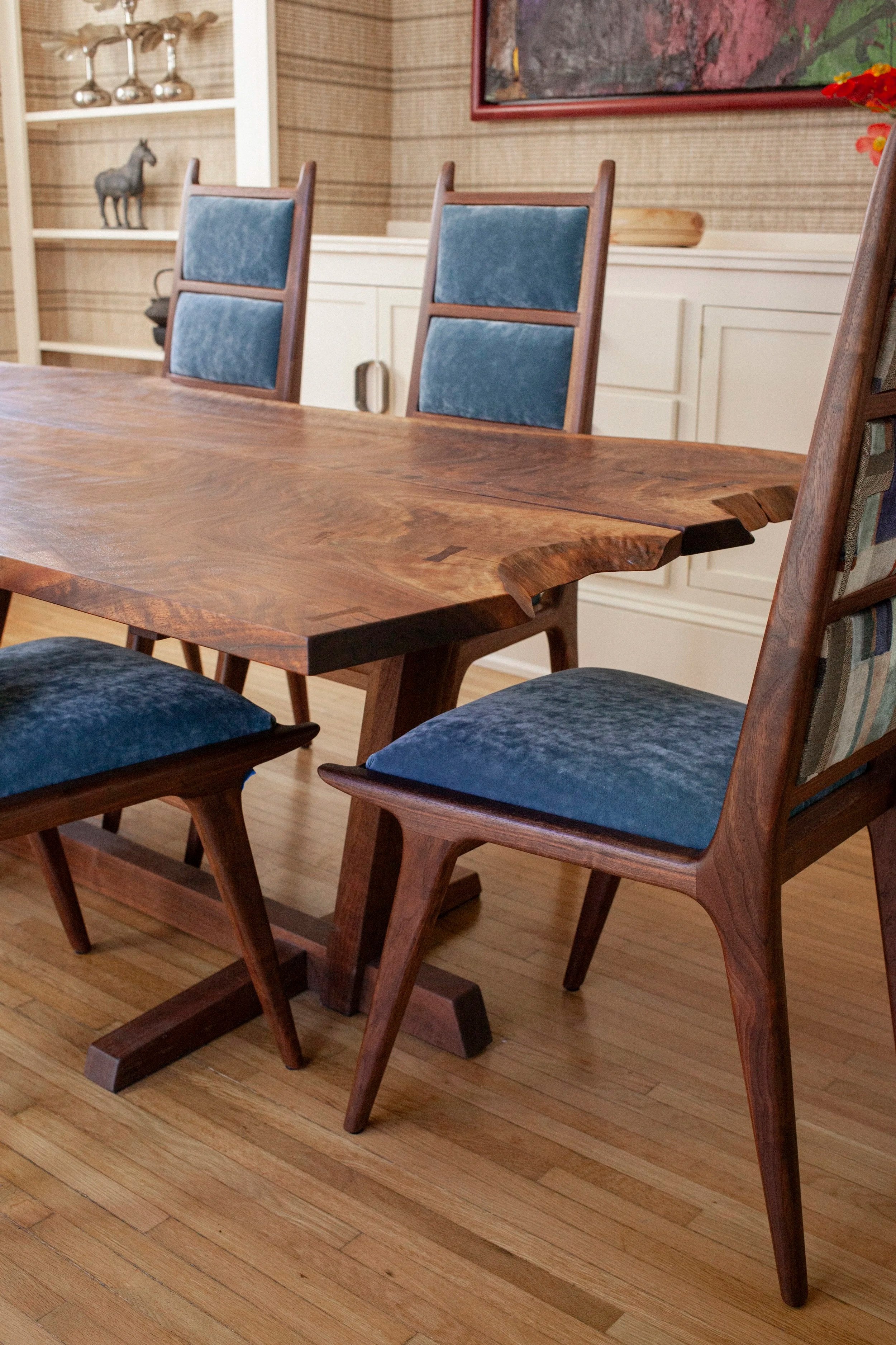 walnut dining set featuring book-matched walnut slabs, Nakashima inspired base, and high back walnut dining chairs