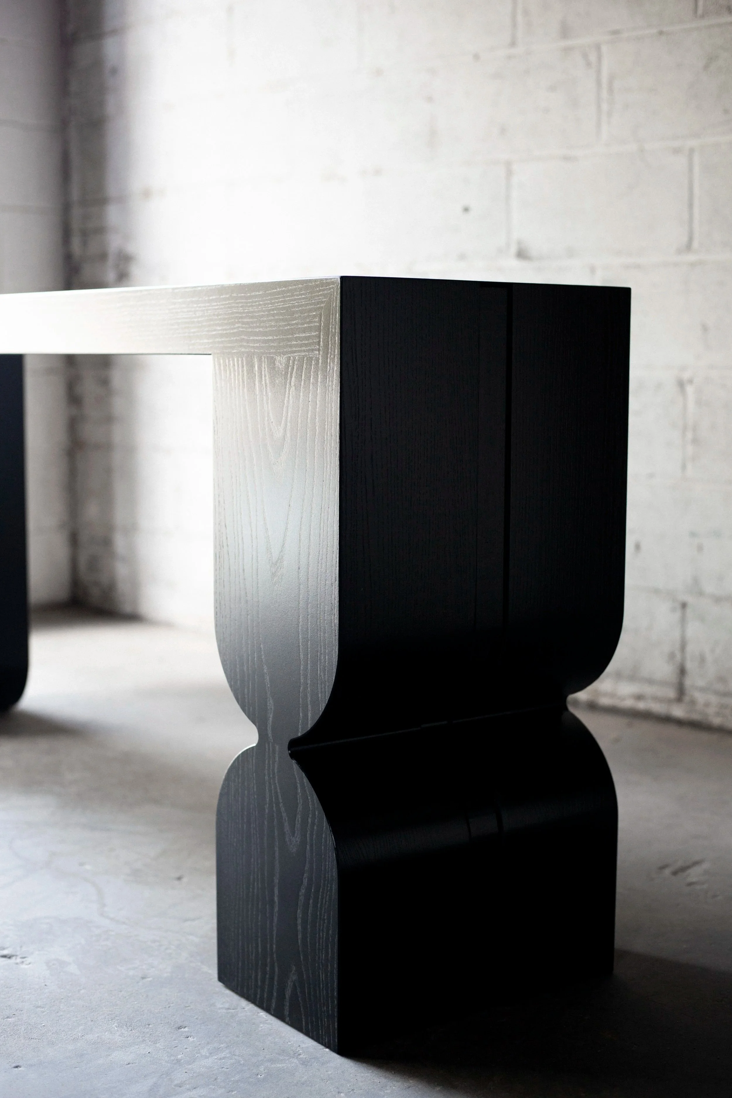 blackened ash modern console table with art deco feet
