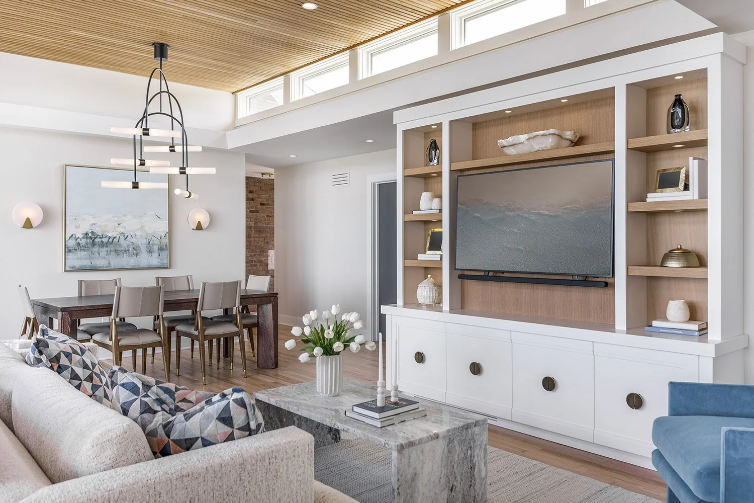 open concept living and dining, built-in entertainment center, refinished red oak flooring | Ducy Design