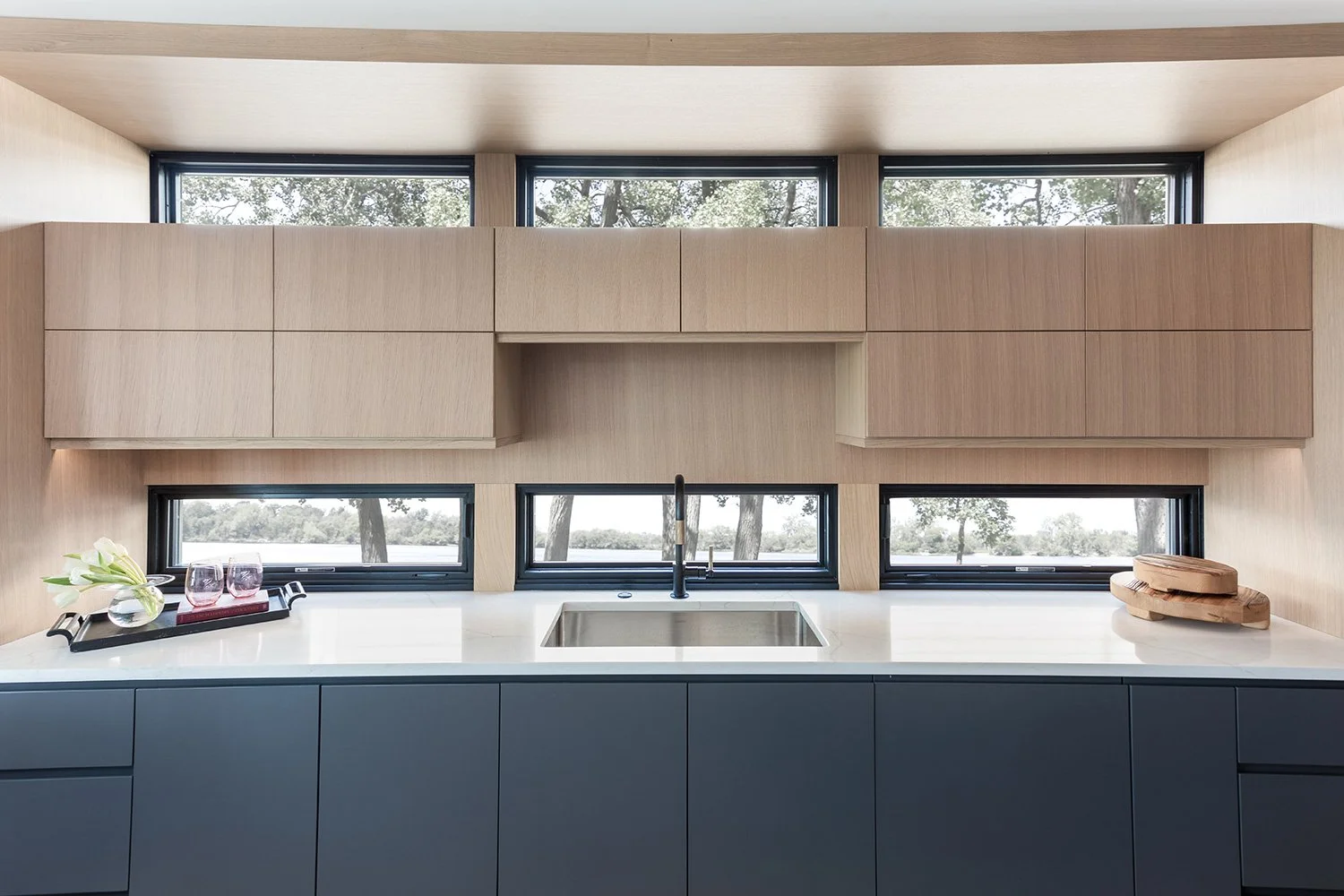 rift white oak cabinetry, flat panel cabinetry, quartz countertop, built-in transom windows, galley kitchen | Ducy Design