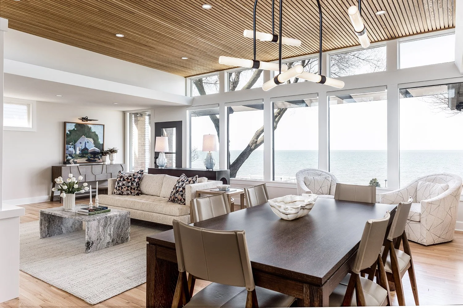 open concept living and dining room, reeded white oak ceiling detail, refinished red oak flooring | Ducy Design