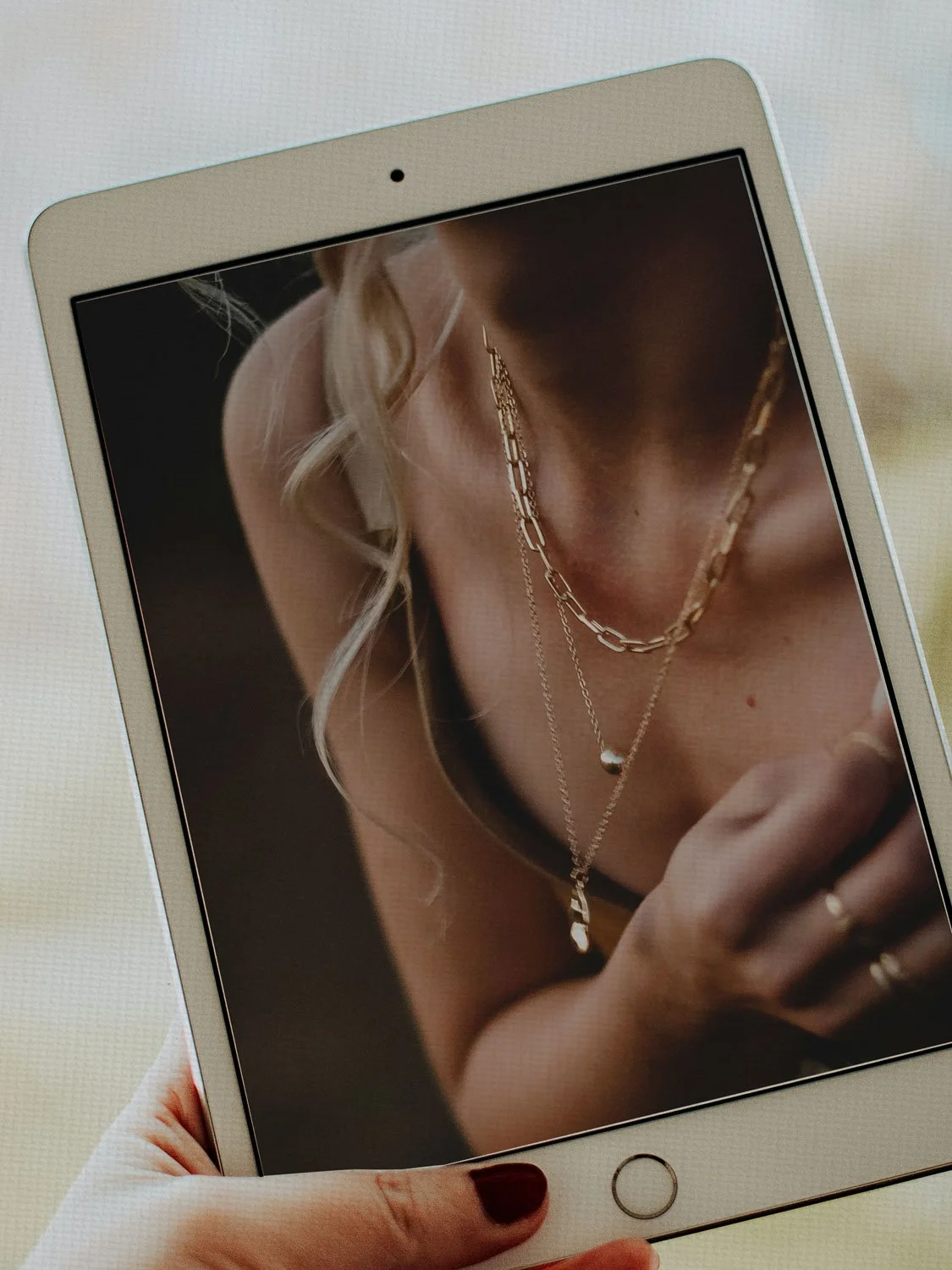 Tablet displaying brand imagery, reflecting the creative vision behind Mariposa Creative Co.
