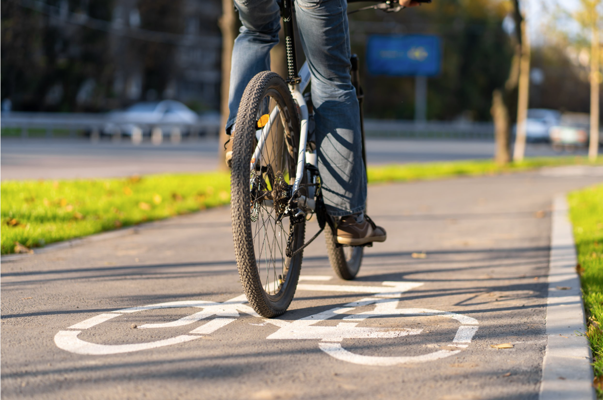 A person rides a bike along a cycle lan