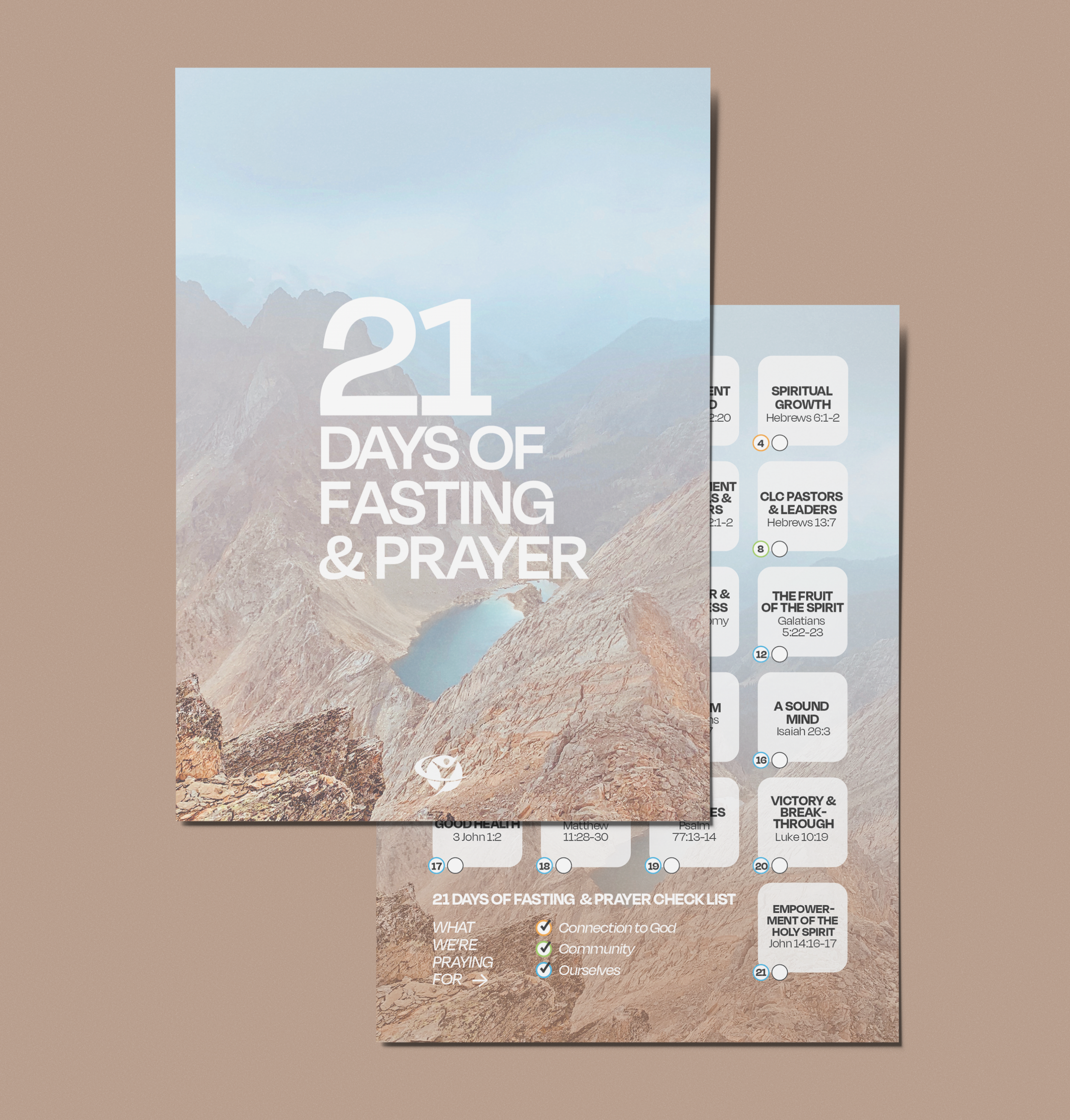 A booklet titled '21 Days of Fasting & Prayer' featuring mountain landscape imagery on the cover. The inside pages display a checklist of daily prayer topics with references from the Bible, alongside icons indicating connection to God, community, and ourselves.