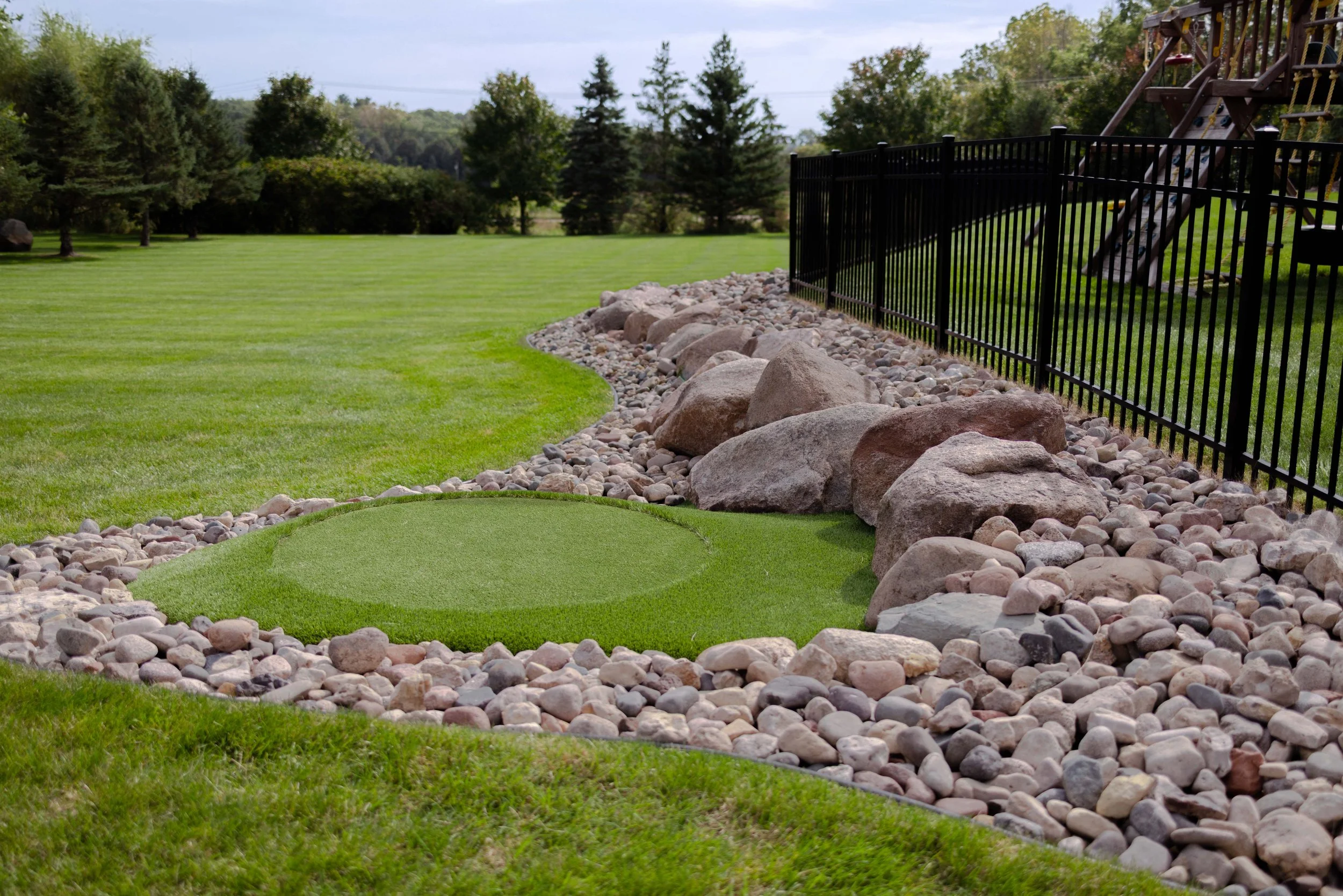 Custom backyard golf green installed in collaboration with GreenImage Golfscapes. 