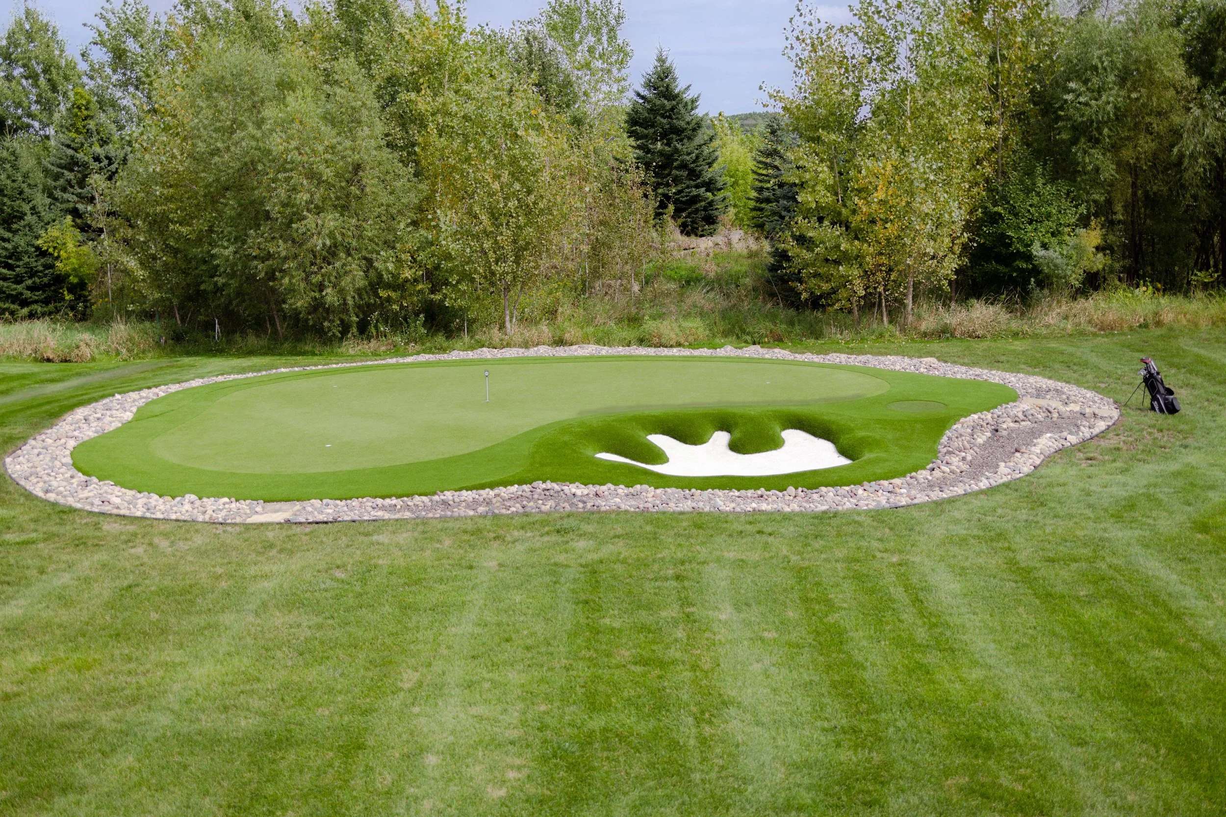 Custom backyard golf green installed in collaboration with GreenImage Golfscapes. 