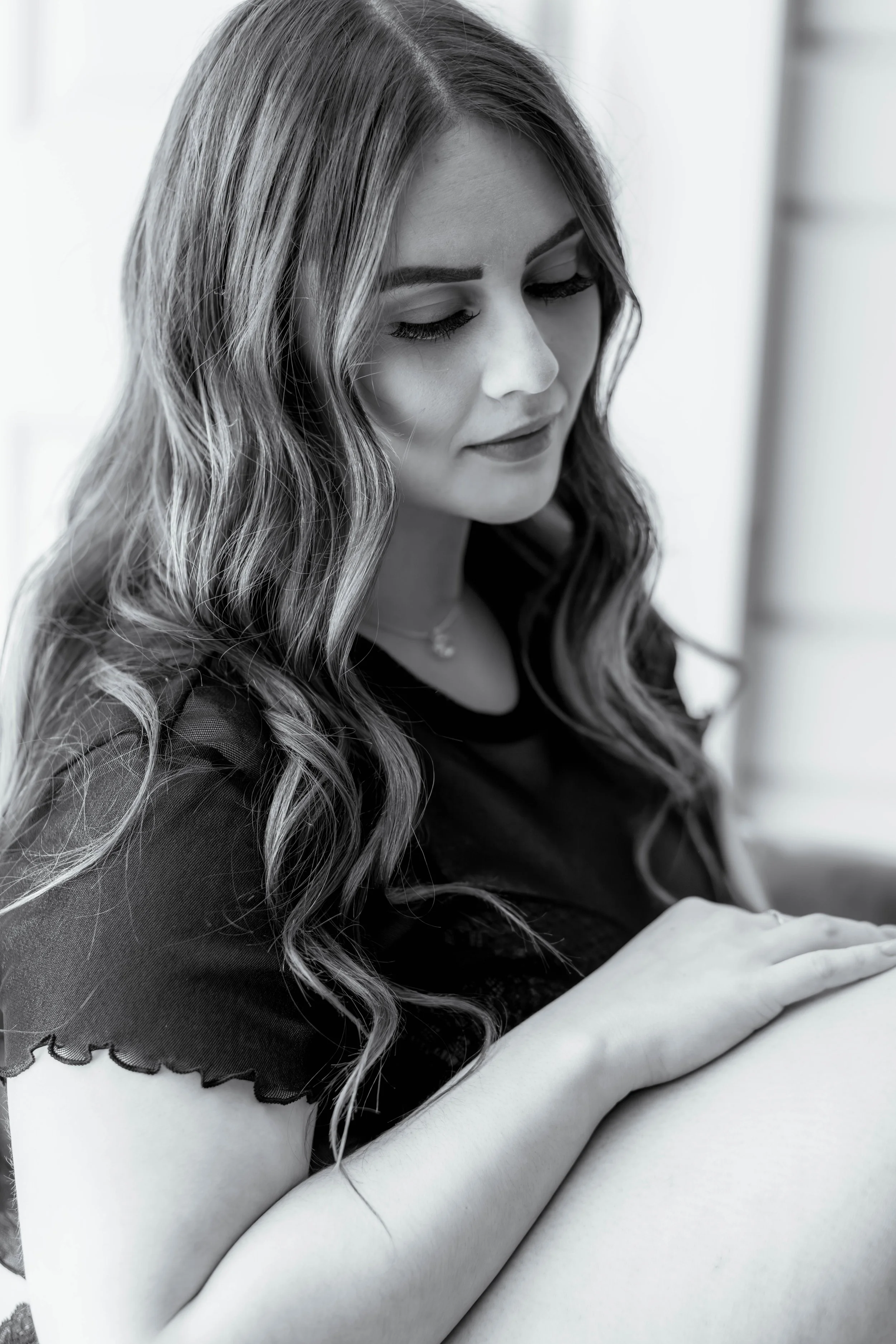 You can express yourself uniquely in your boudoir session by allowing yourself to be like this dark-haired beauty - eyes averted, face peaceful, letting the beauty of being you just radiate from your peacefulness.