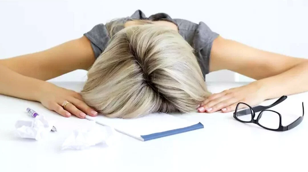 WomanAsleepatDesk.jpg