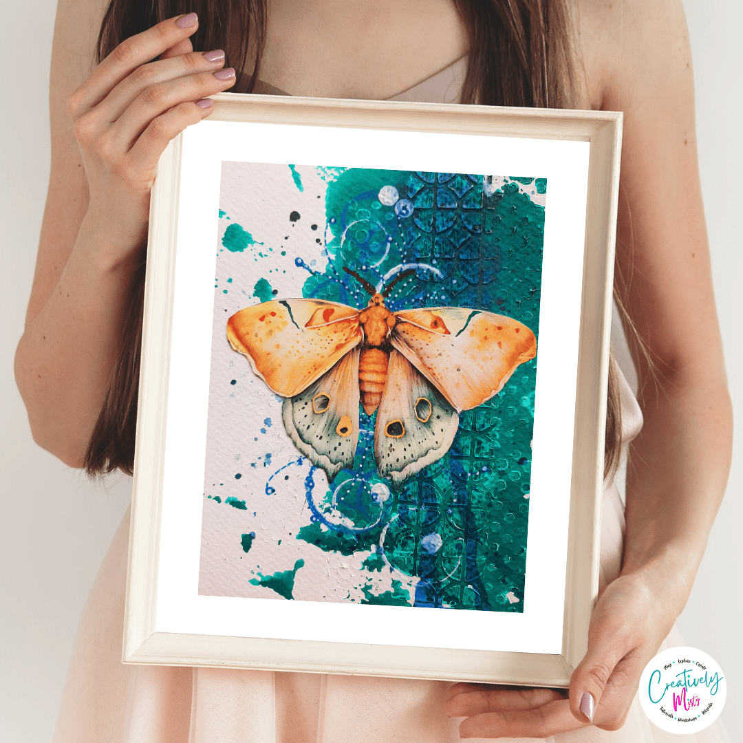Framed, Wings of Becoming Limited Edition Giclee Print being held by a woman