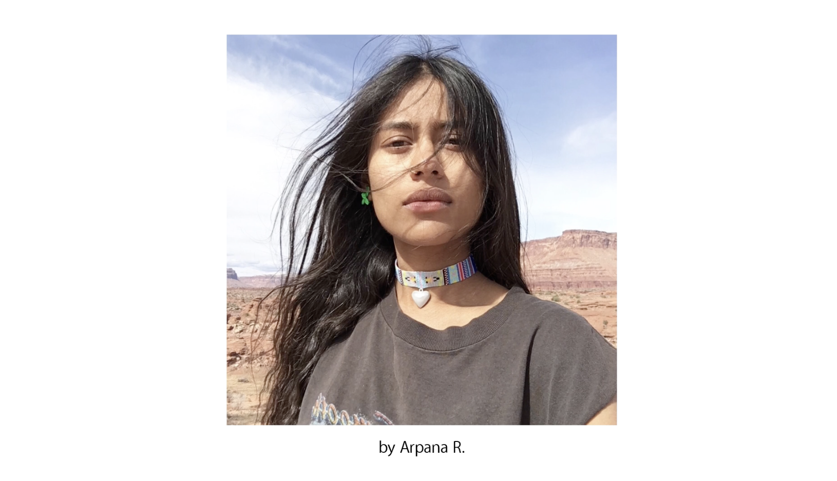 a still from an ad for apple featuring portraits of people around the world taken on an iPhone, with the voiceover of Maya Angelou's "Human Family" poem in celebration of global cultural diversity