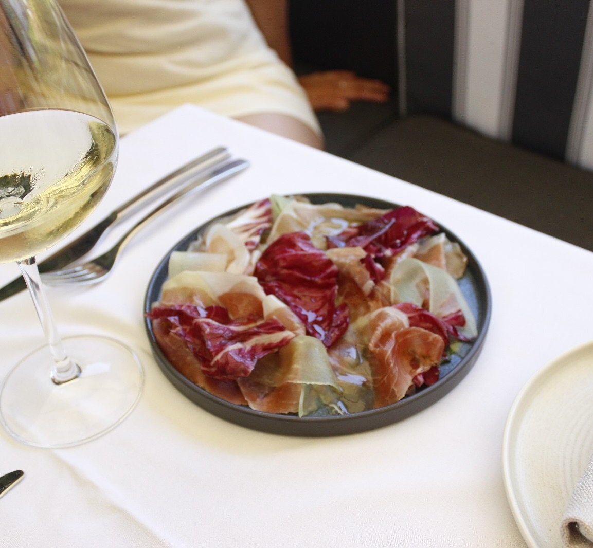 New to our summer menu is a 24 month prosciutto di Parma served on top of a luscious pistachio pesto with marinated honeydew melon, raddicchio and extra virgin olive oil. #newseason #newmenu