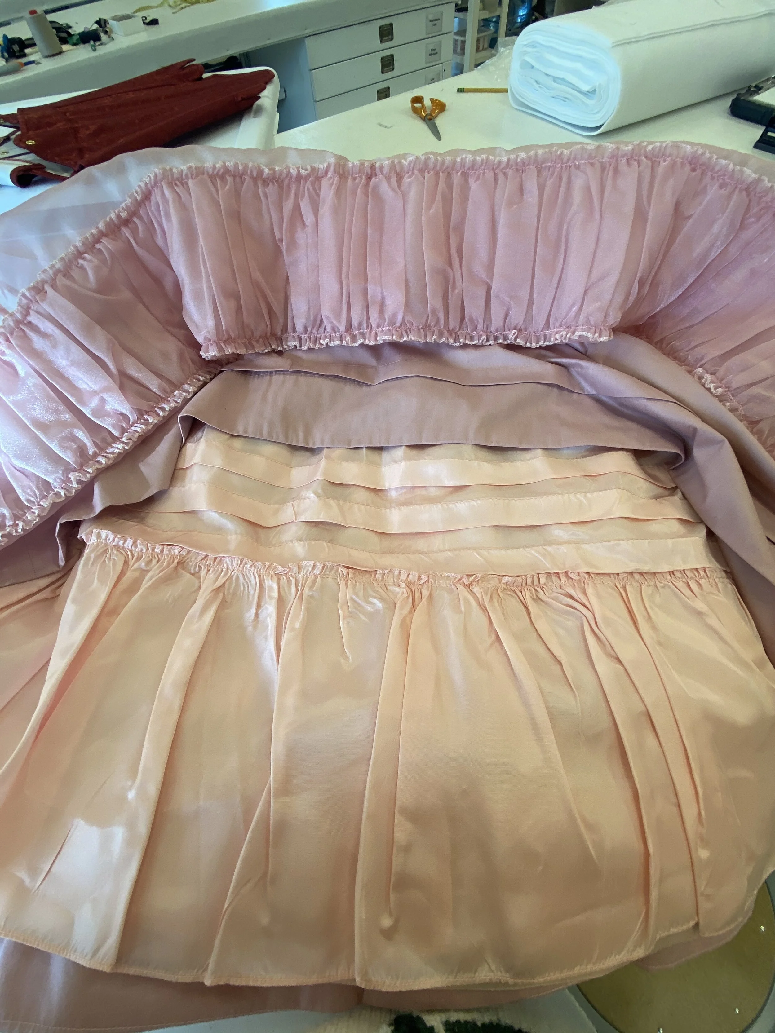 The tucks and ruffle.