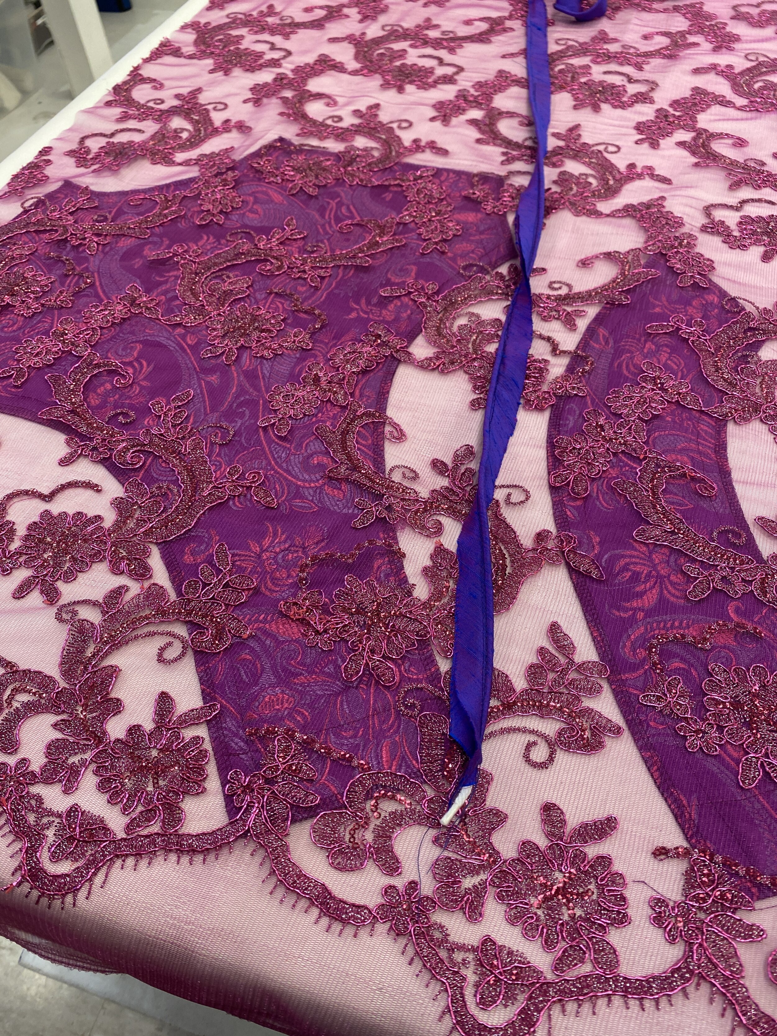 Focused on pattern placement when cutting out pieces. Cut, fused, and serged all pieces and layers, including piping. 
