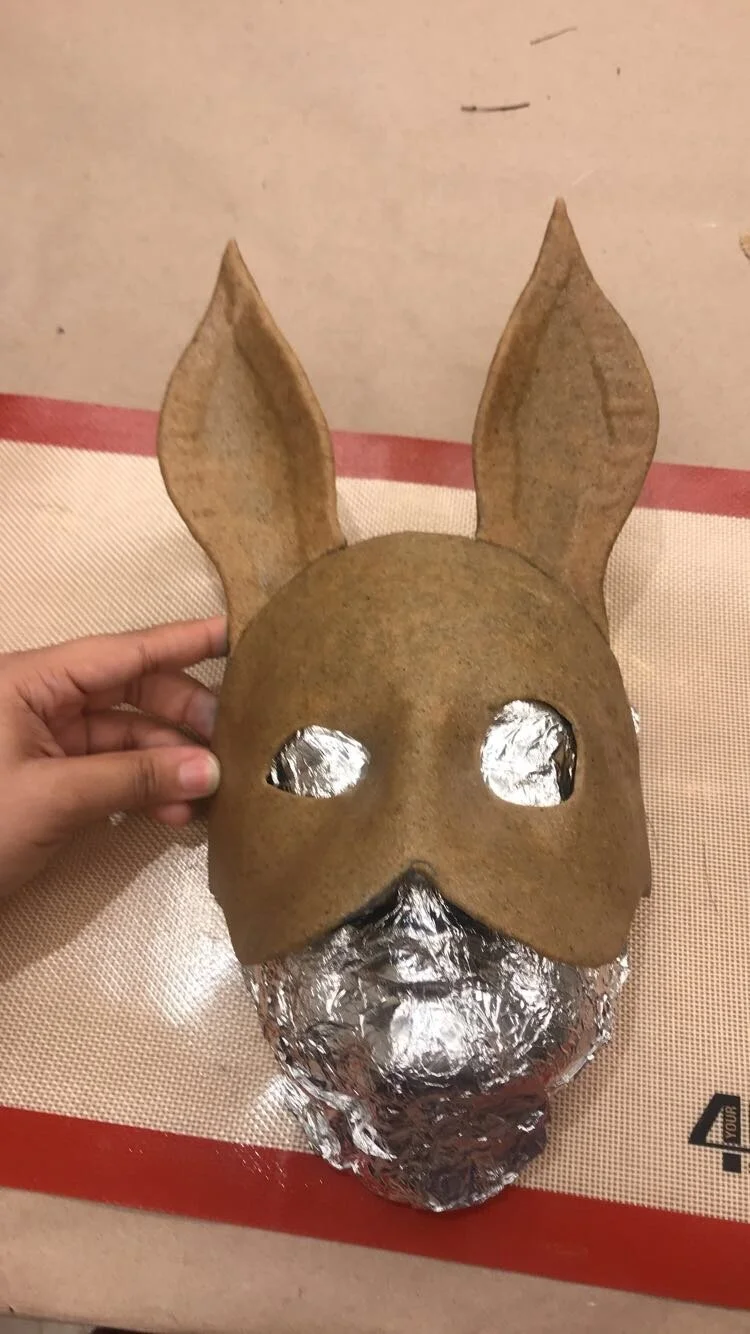 Class assignment. Warbla white rabbit mask before painting. 