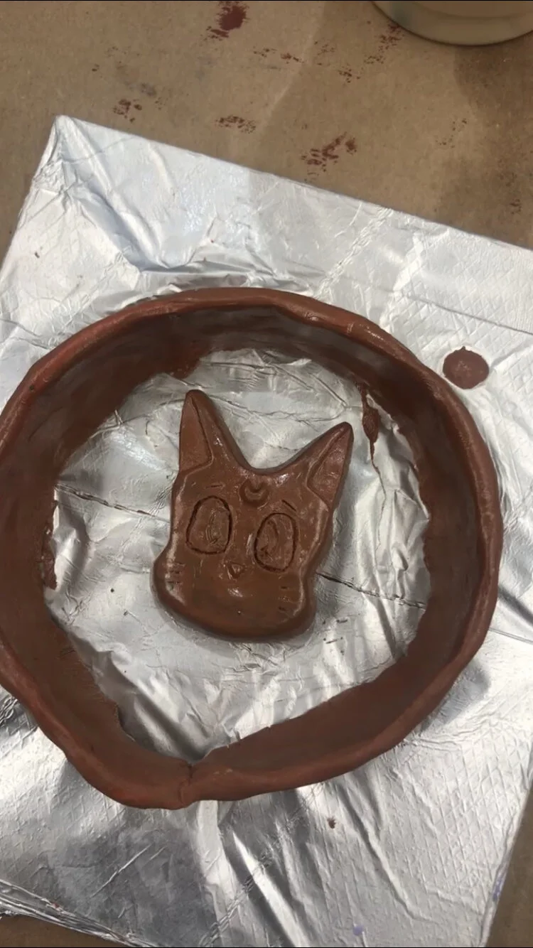 Class assignment. Sculpted pendant, reading to create resin mold.