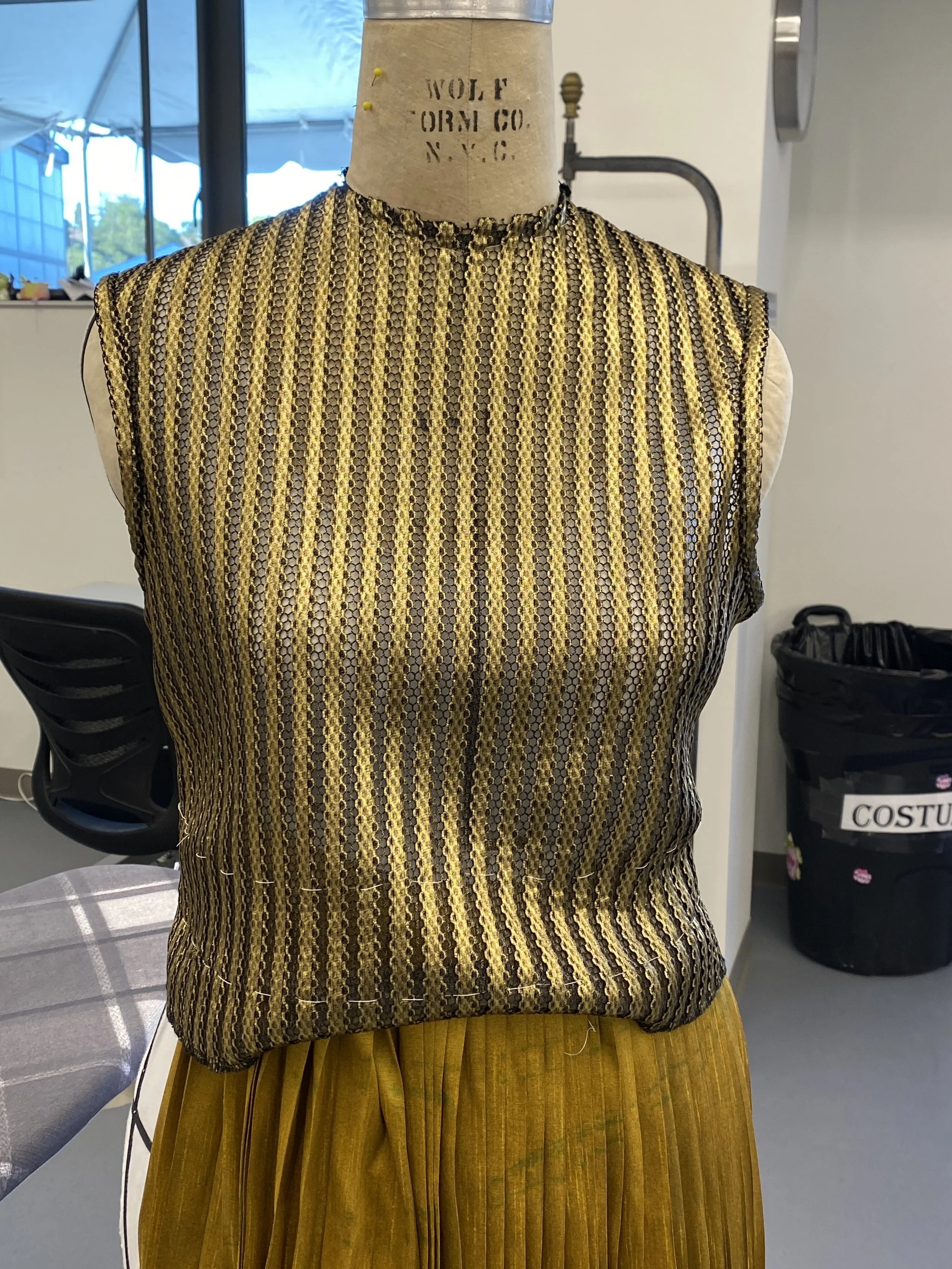 Mesh shirt on the form. 