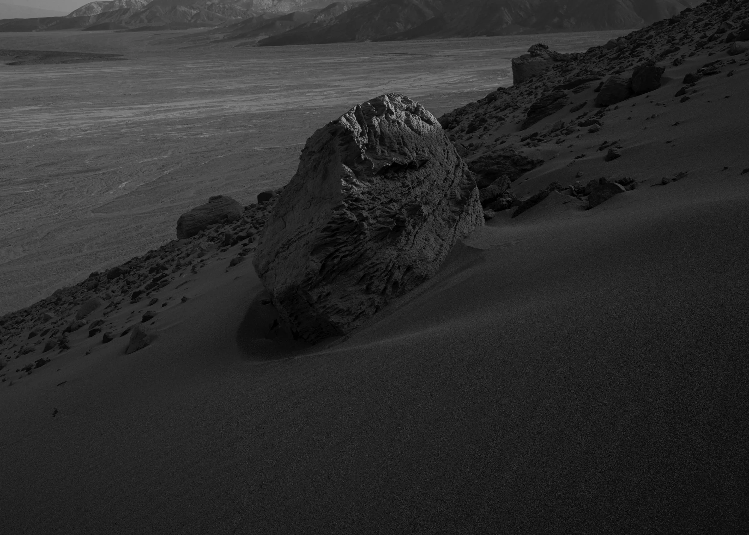 rock-on-the-edge-of-a-sand-dune 1.jpg