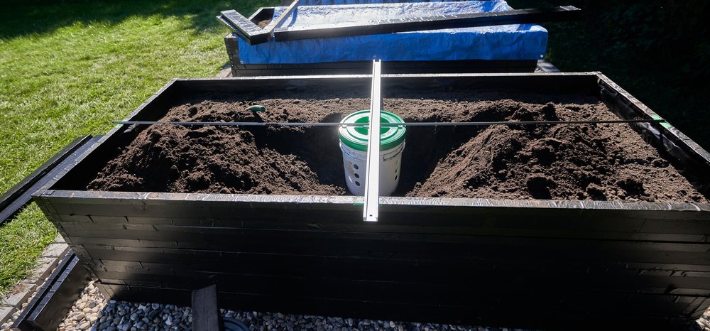 Excavate the planter a bit