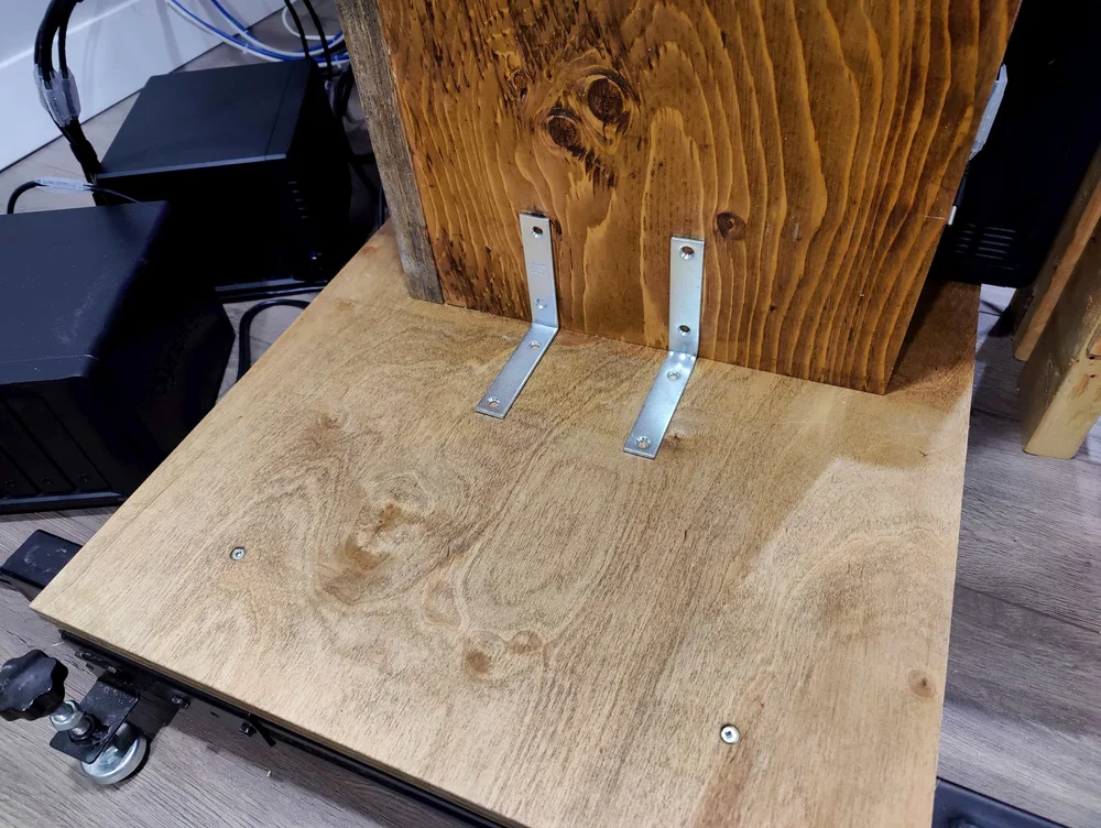 Securing the network rack to the base