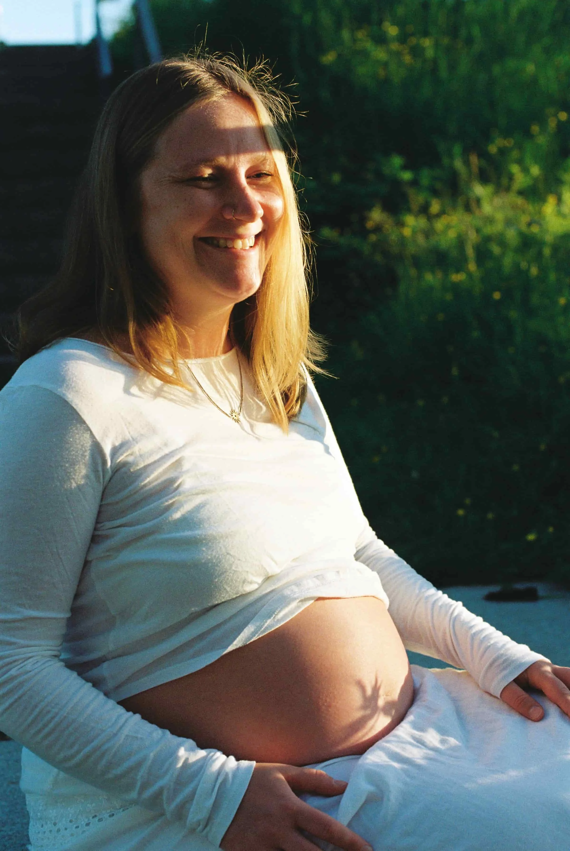 golden hour Vancouver maternity photographer smile long hair baby belly