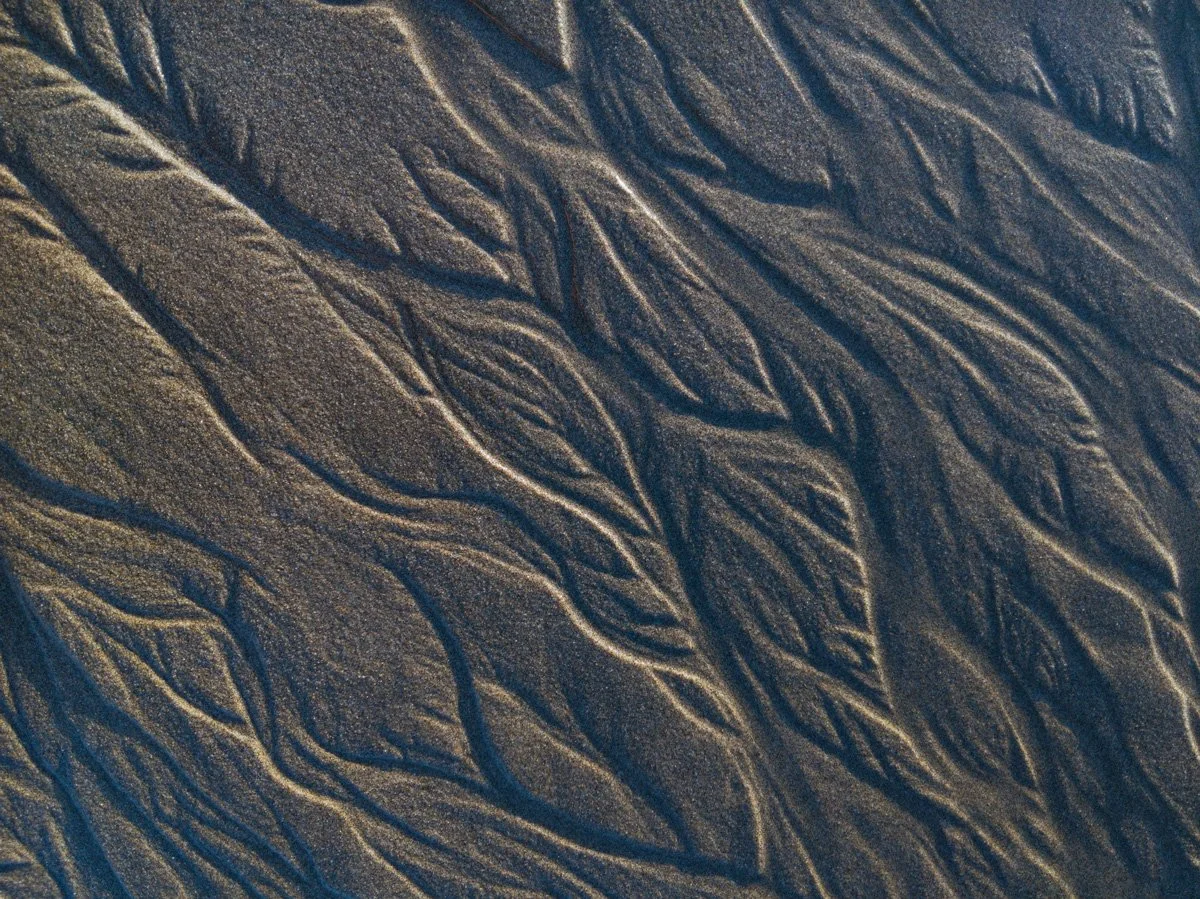 Abstract architectural photograph of a flowing structural pathway, evoking continuity and forward momentum.
