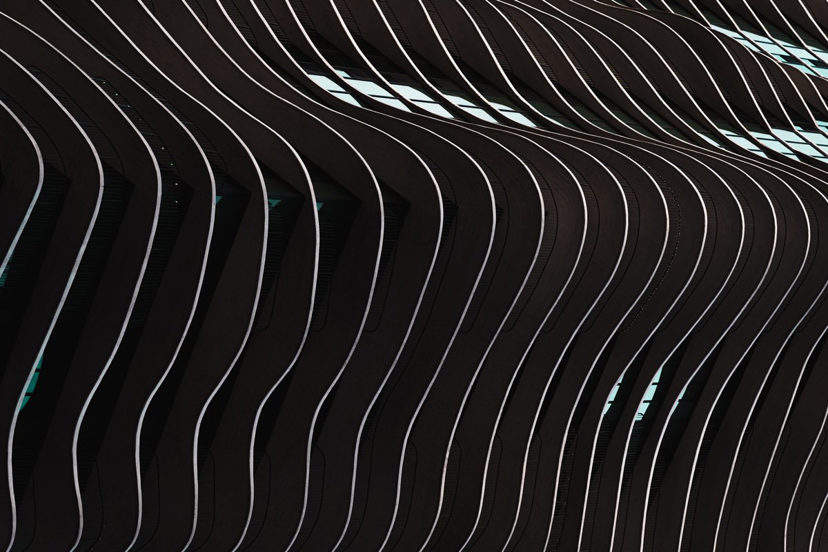Abstract architectural photograph of layered, repeating structural forms, suggesting a reusable system built for scale.