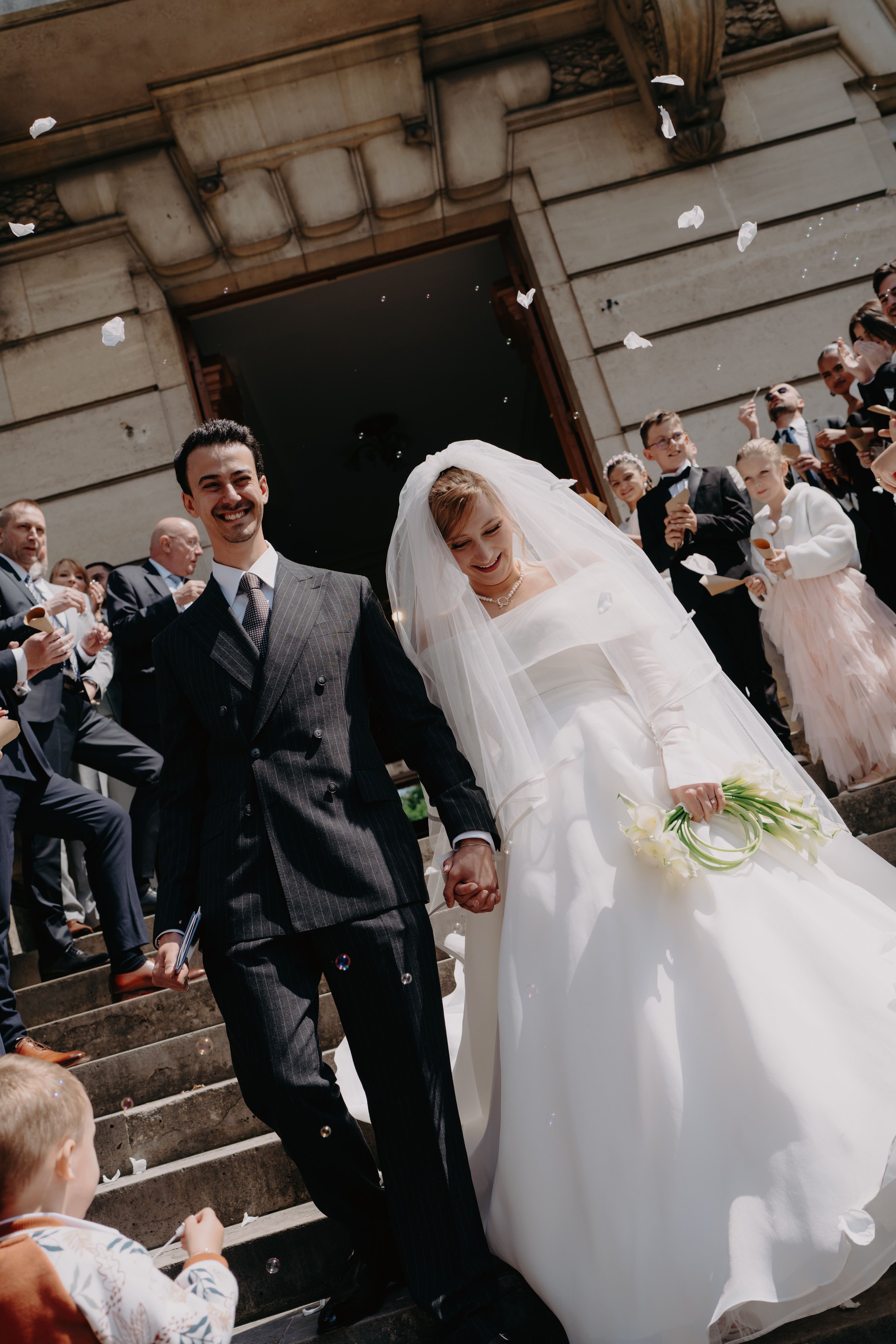 Estelle and Mehdi leaving their ceremony under a shower of confetti