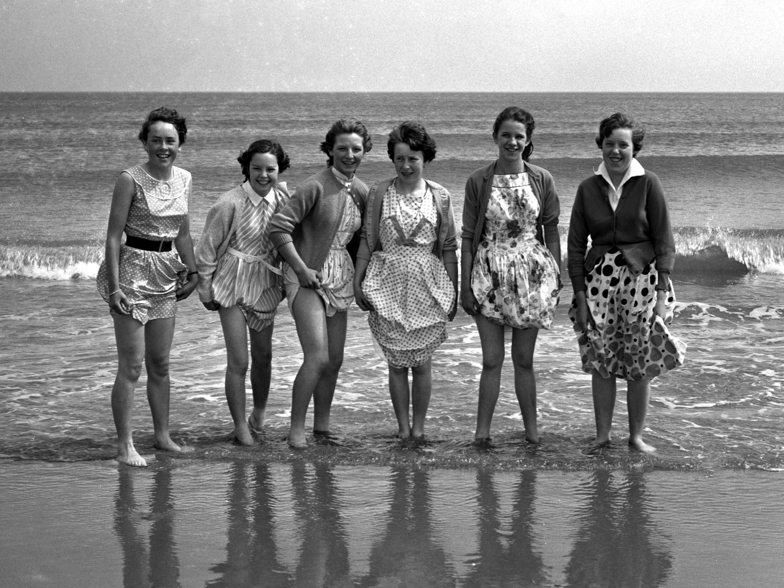 Before the days of mass foreign travel, most people holidayed by the sea. Here a group of girls paddle in the sea at Spittal.
(July 1959) BRO 1944-1-2443-4