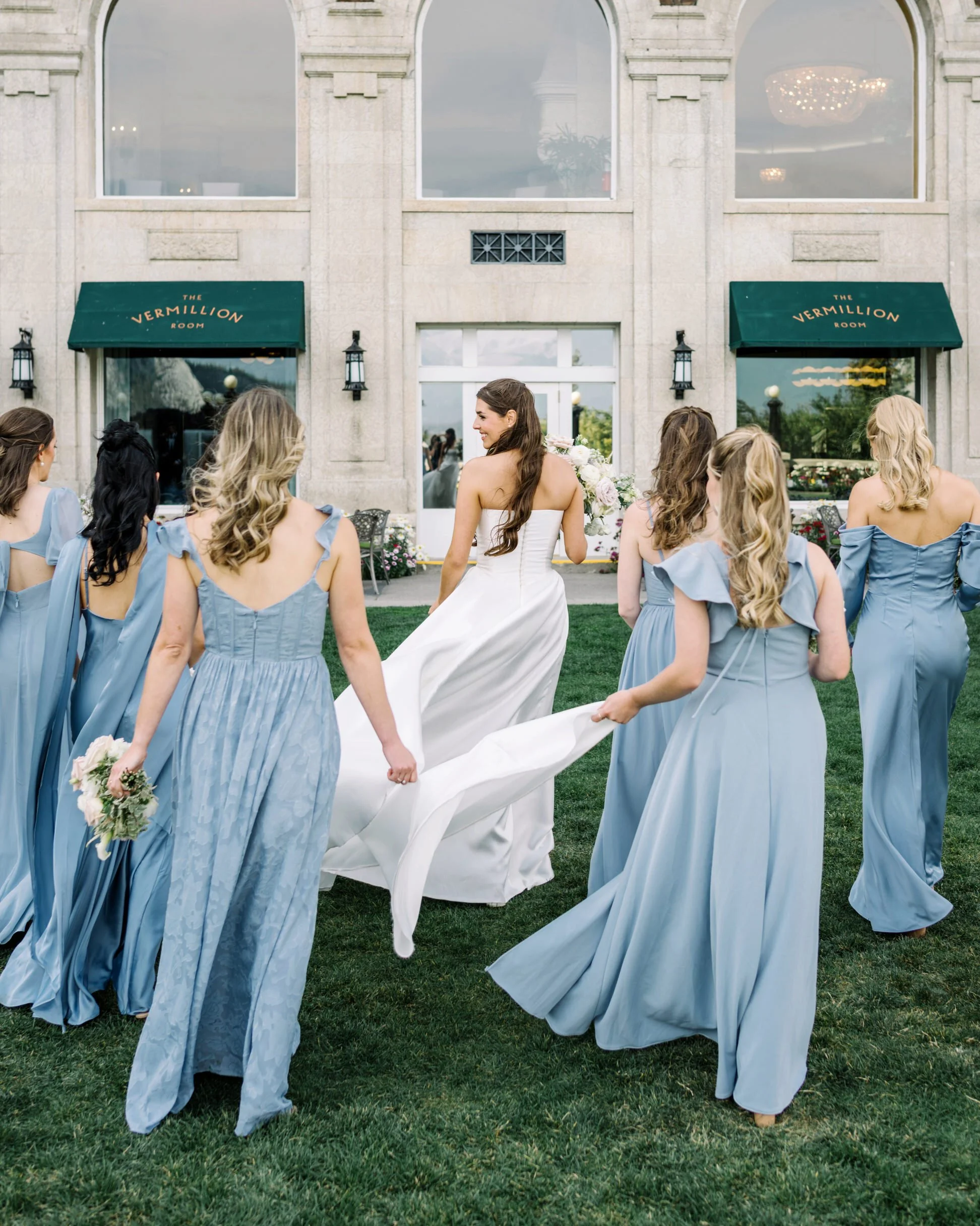 Bride with brides caring the brides train 