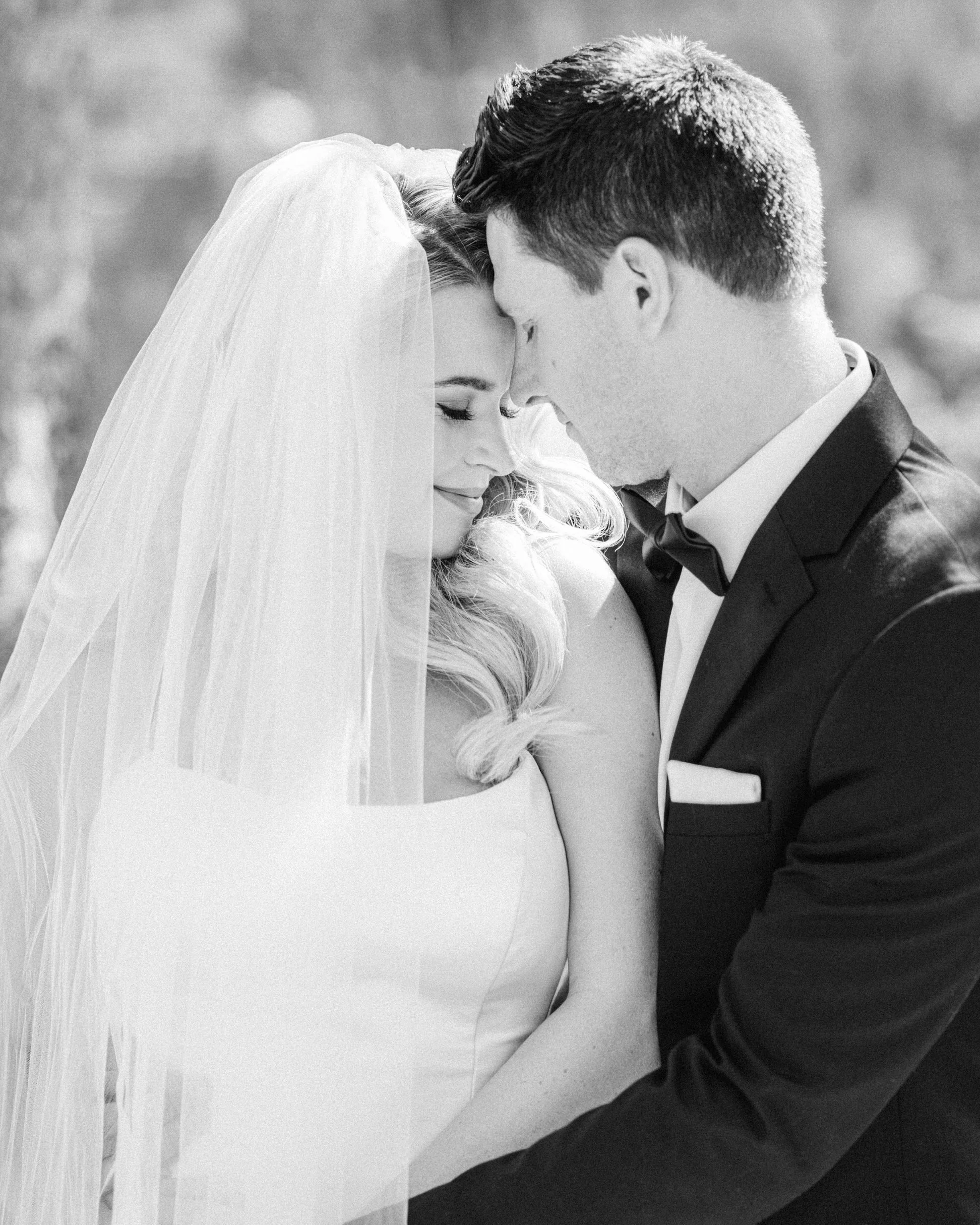 Bride and groom portraits at Bow Falls in Banff
