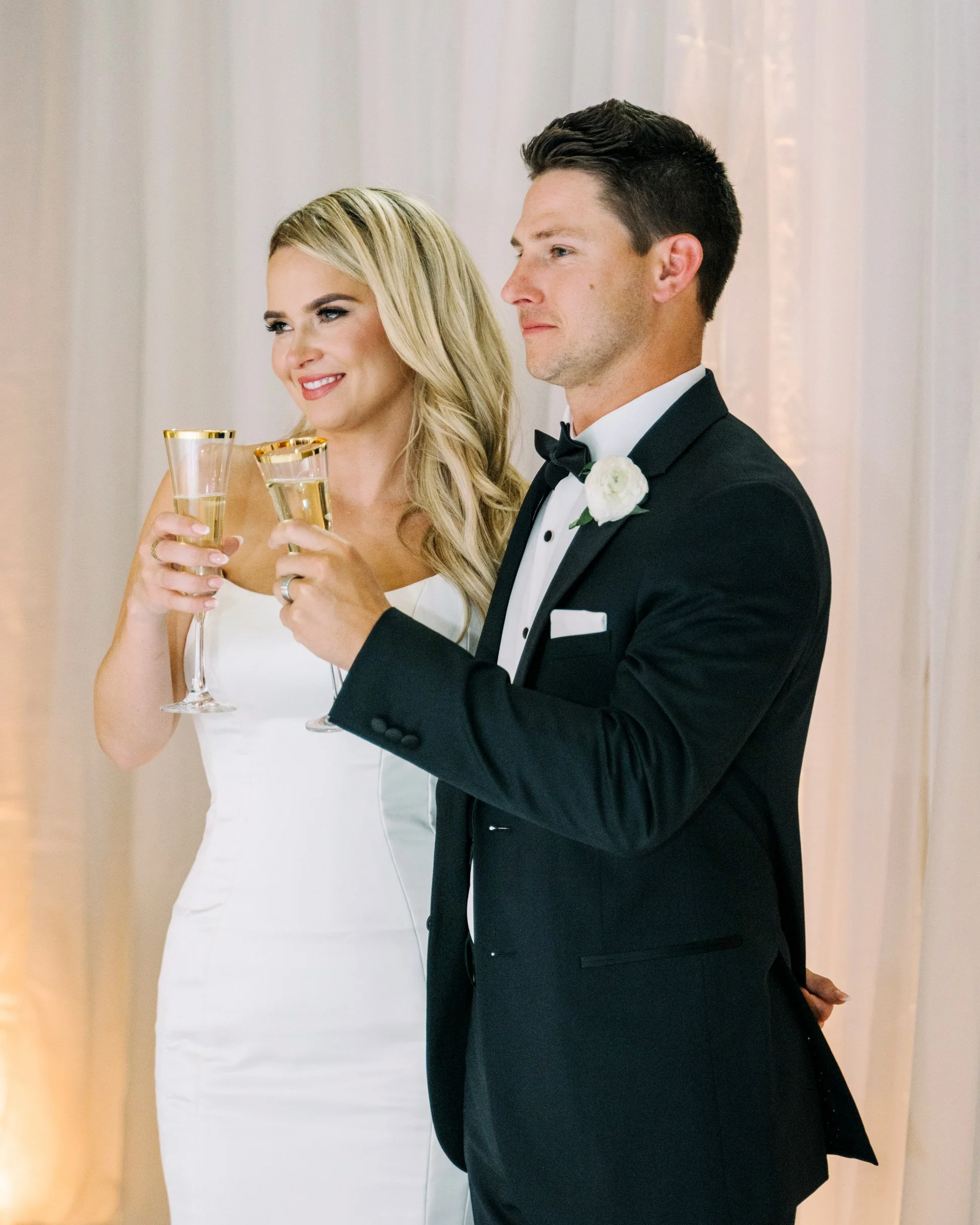 bride and groom toasting during reception at Fairmont Banff Springs