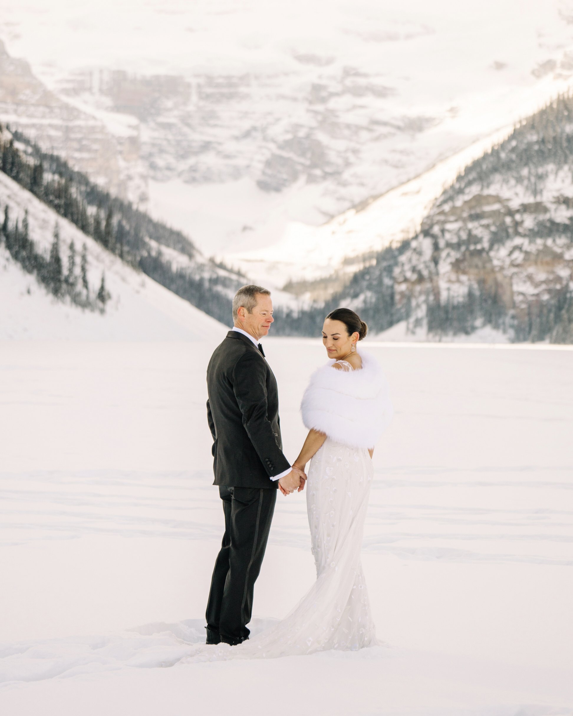 Bride and groom winter portraits at Lake Louise