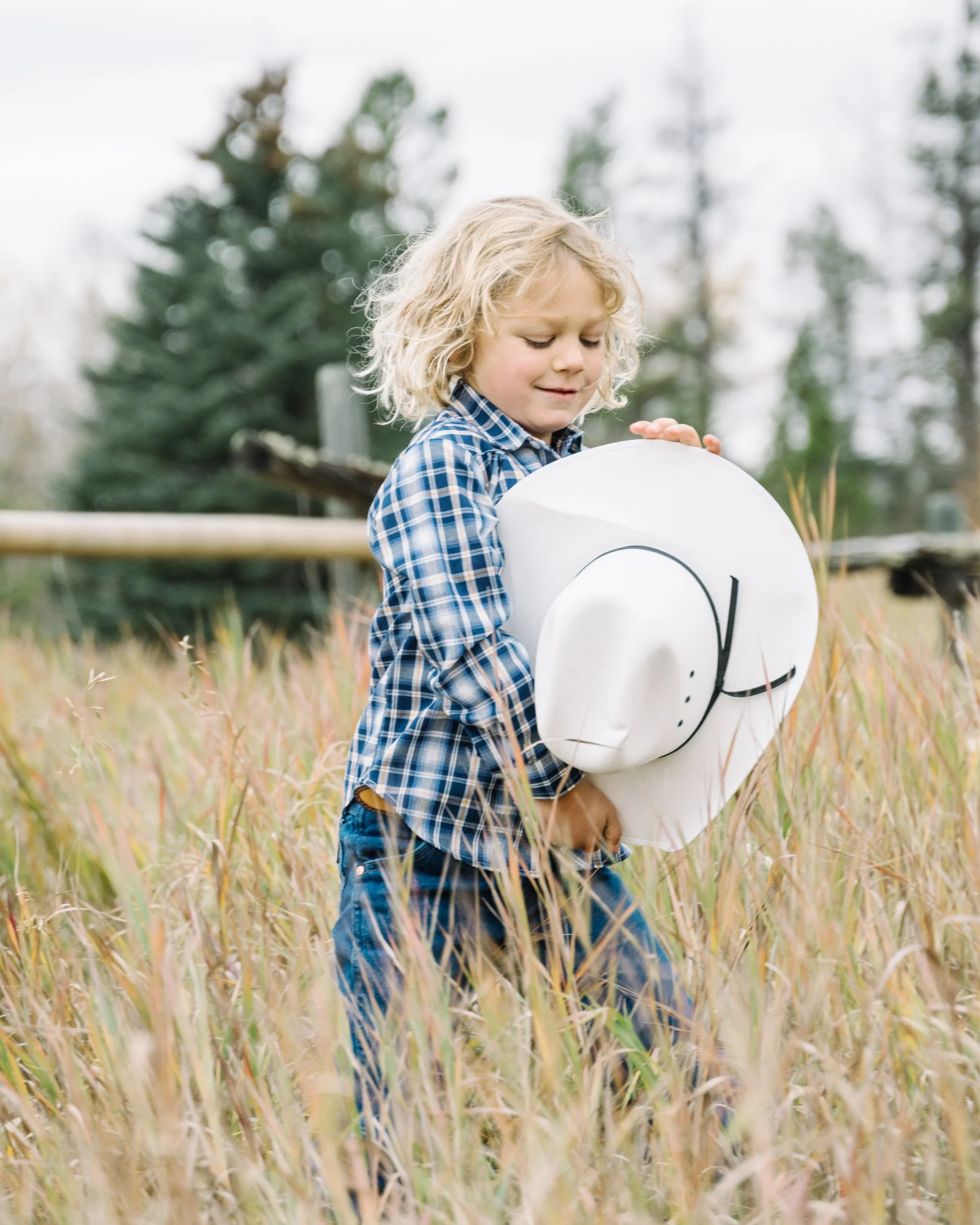 Boy with a cowboy hat during a photo session at Ranch