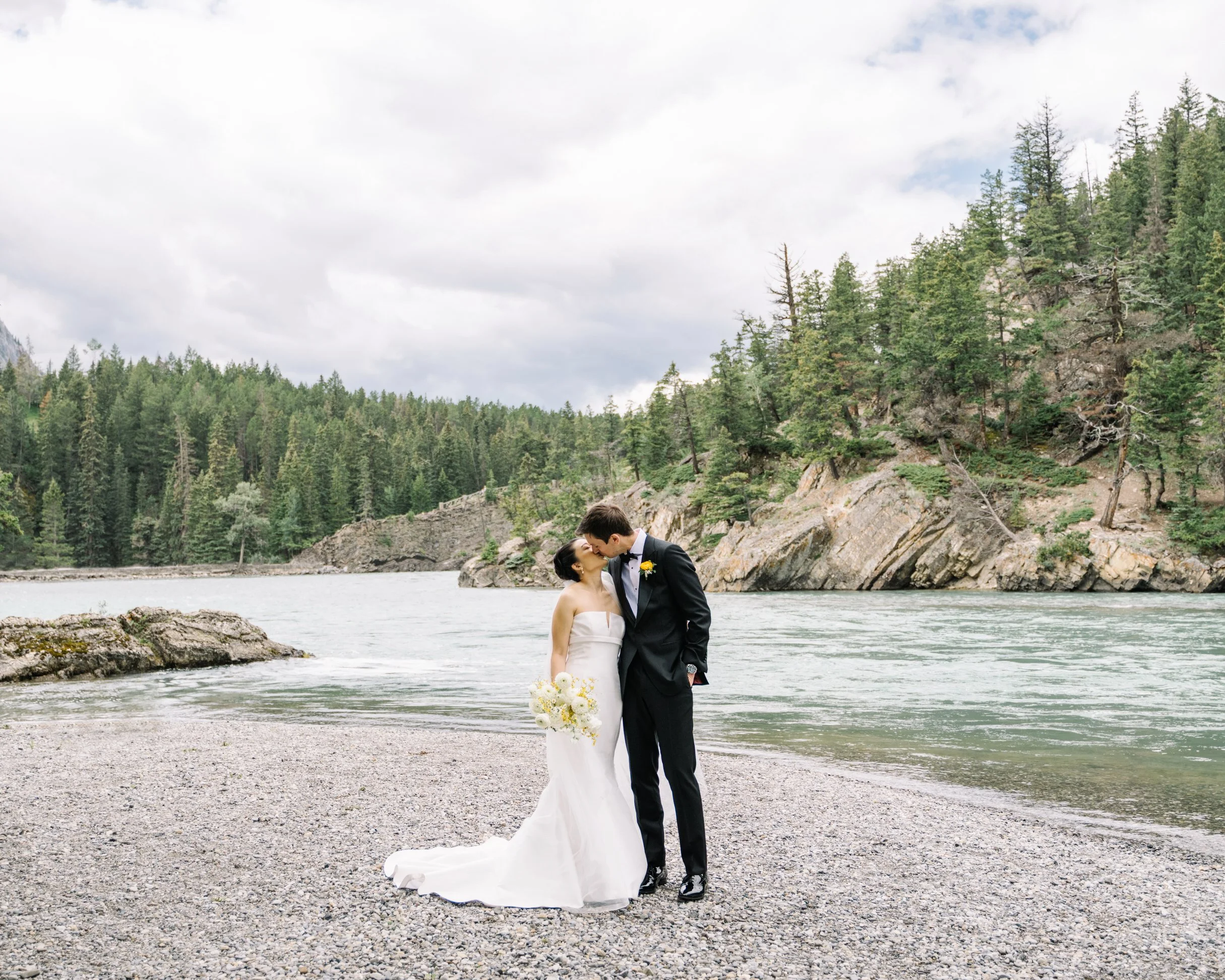 Bride and groom wedding photos at Bow Fall in Banff