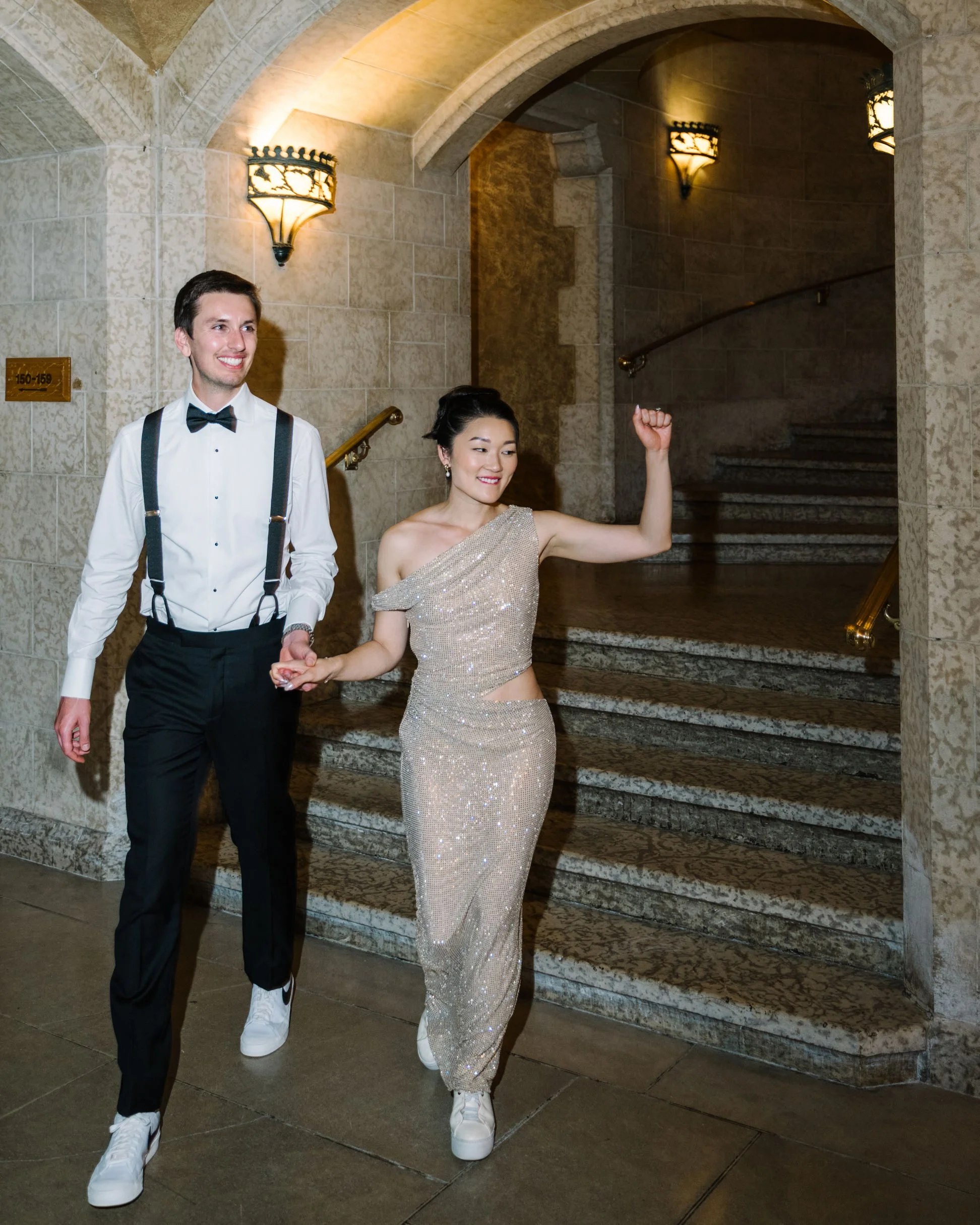 Wedding reception outfit change for bride and groom