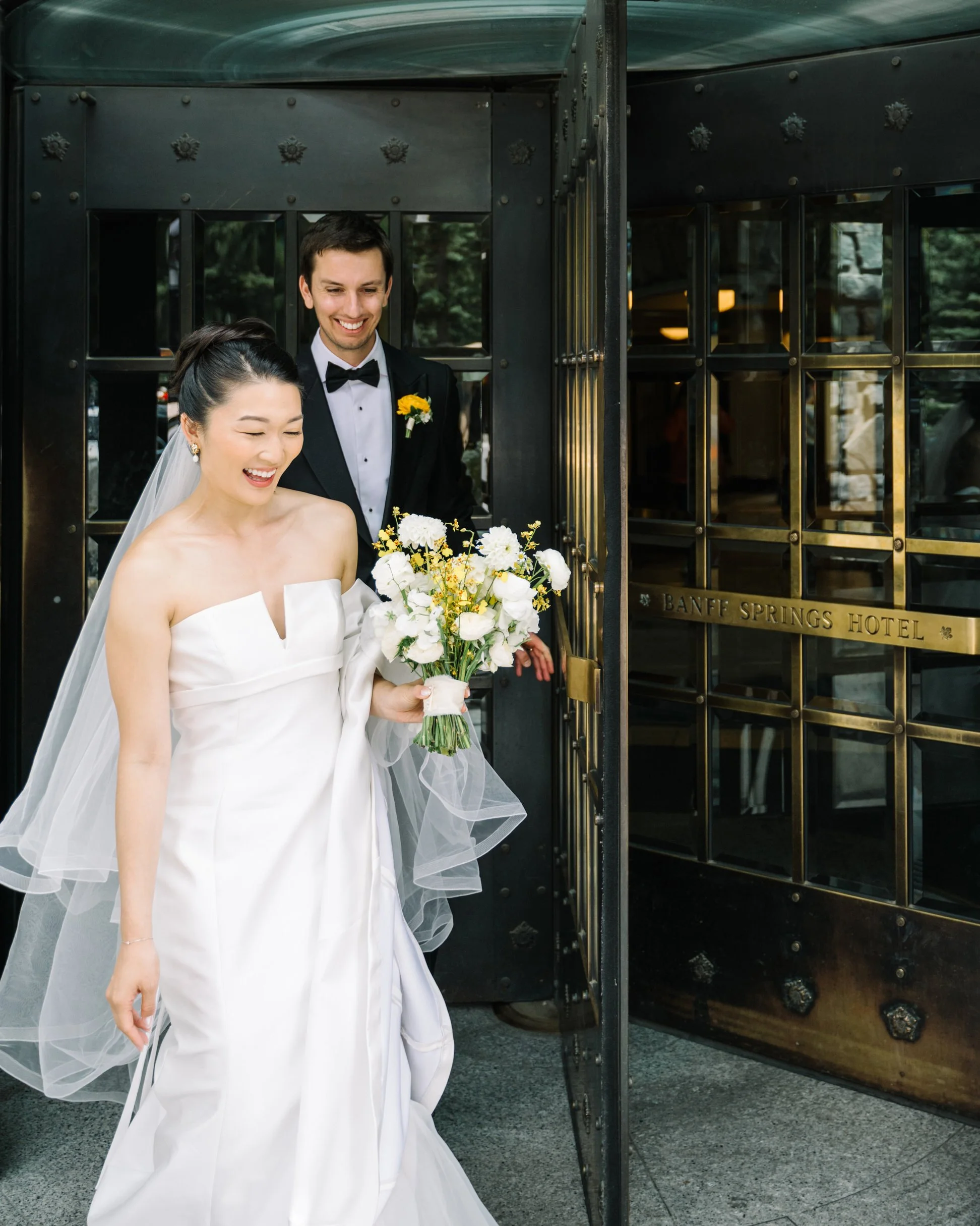 Bride and groom candid wedding moments at the Fairmont Banff Springs 