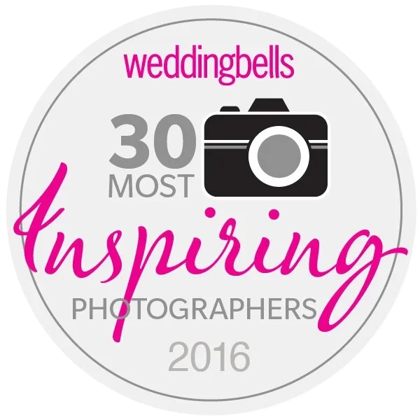 Weddingbells 30 Most Inspiring Photographers 2016 badge with a camera icon.