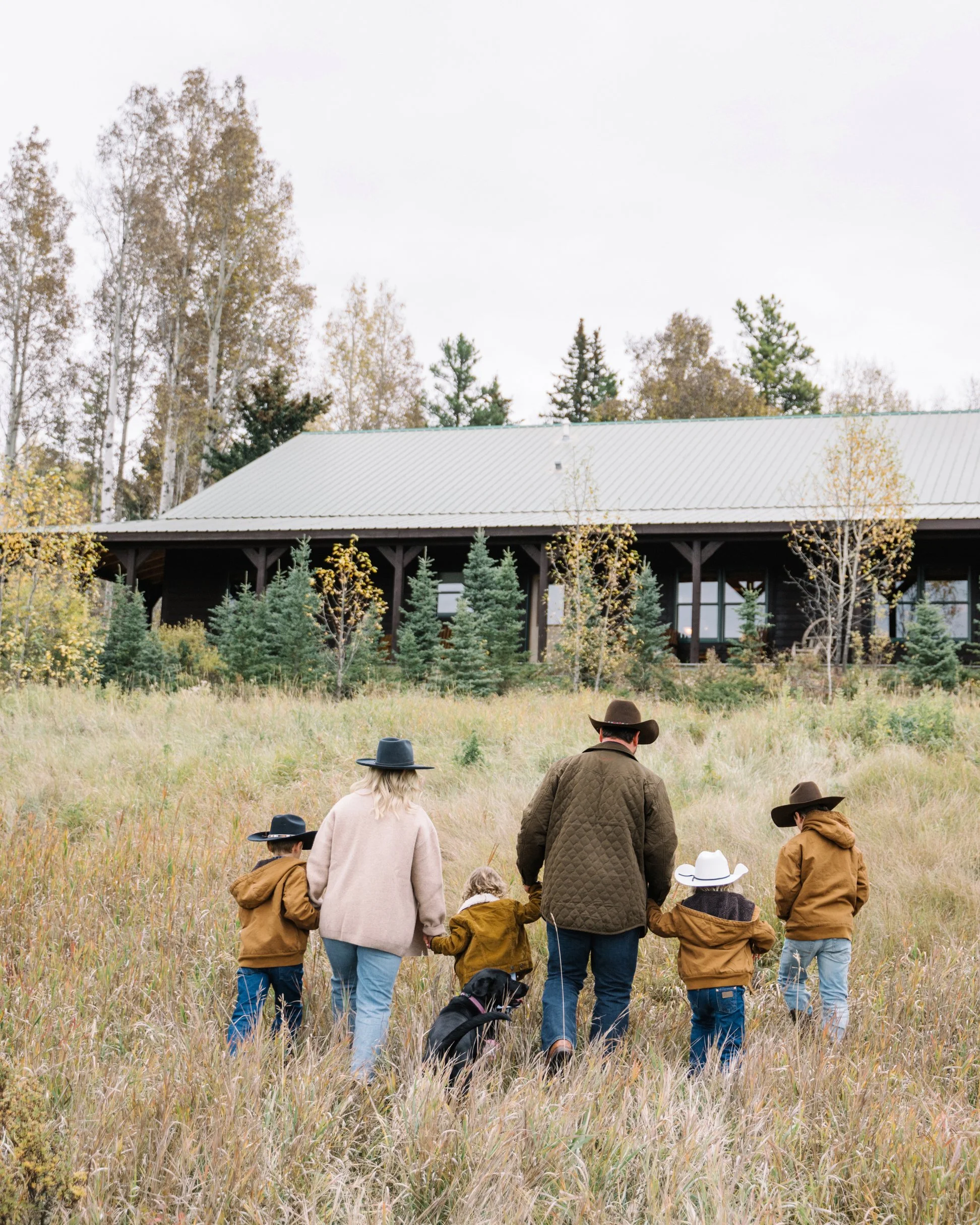 Family fall session at family Ranch with cowboy hats