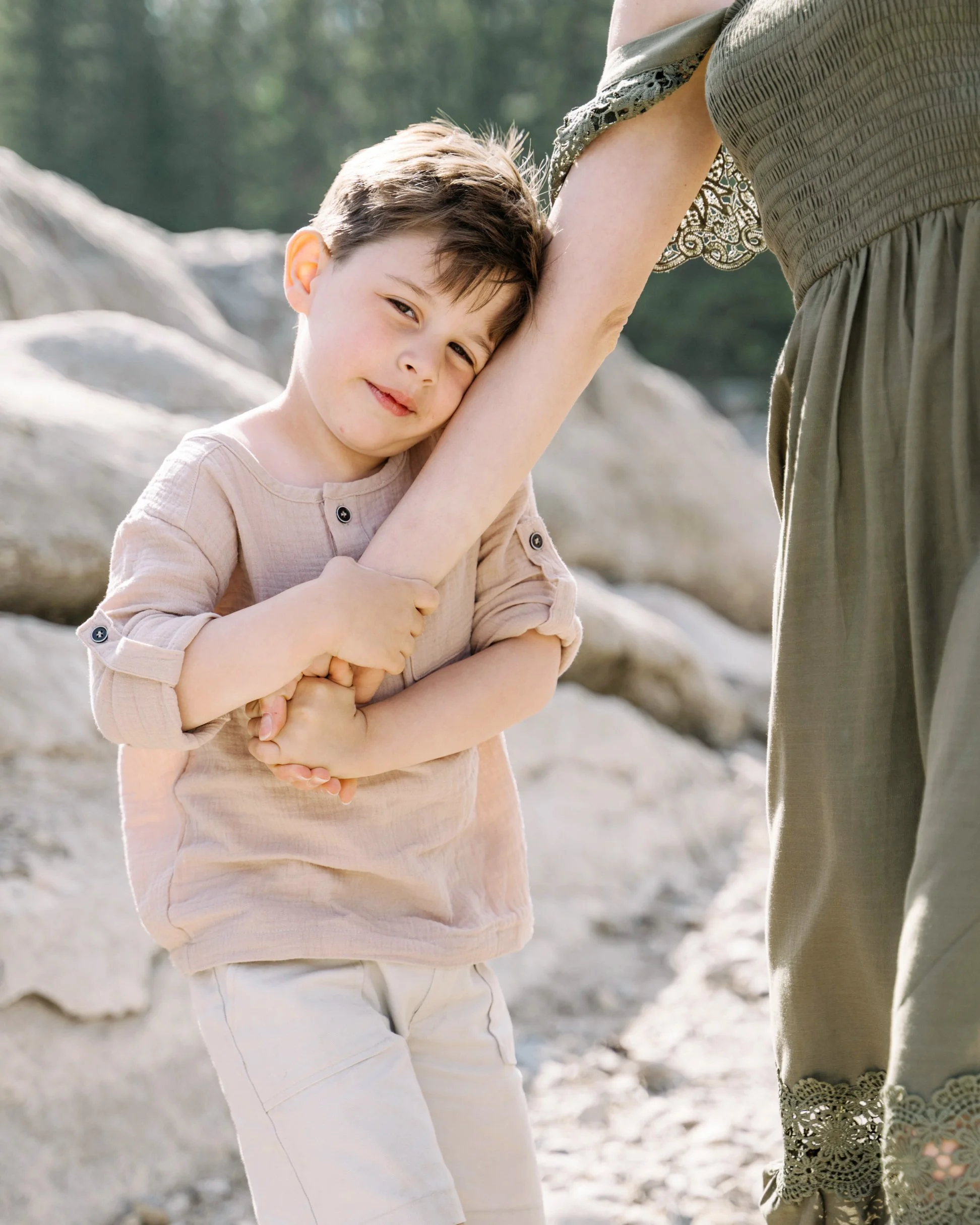mother and son holding hands during family session