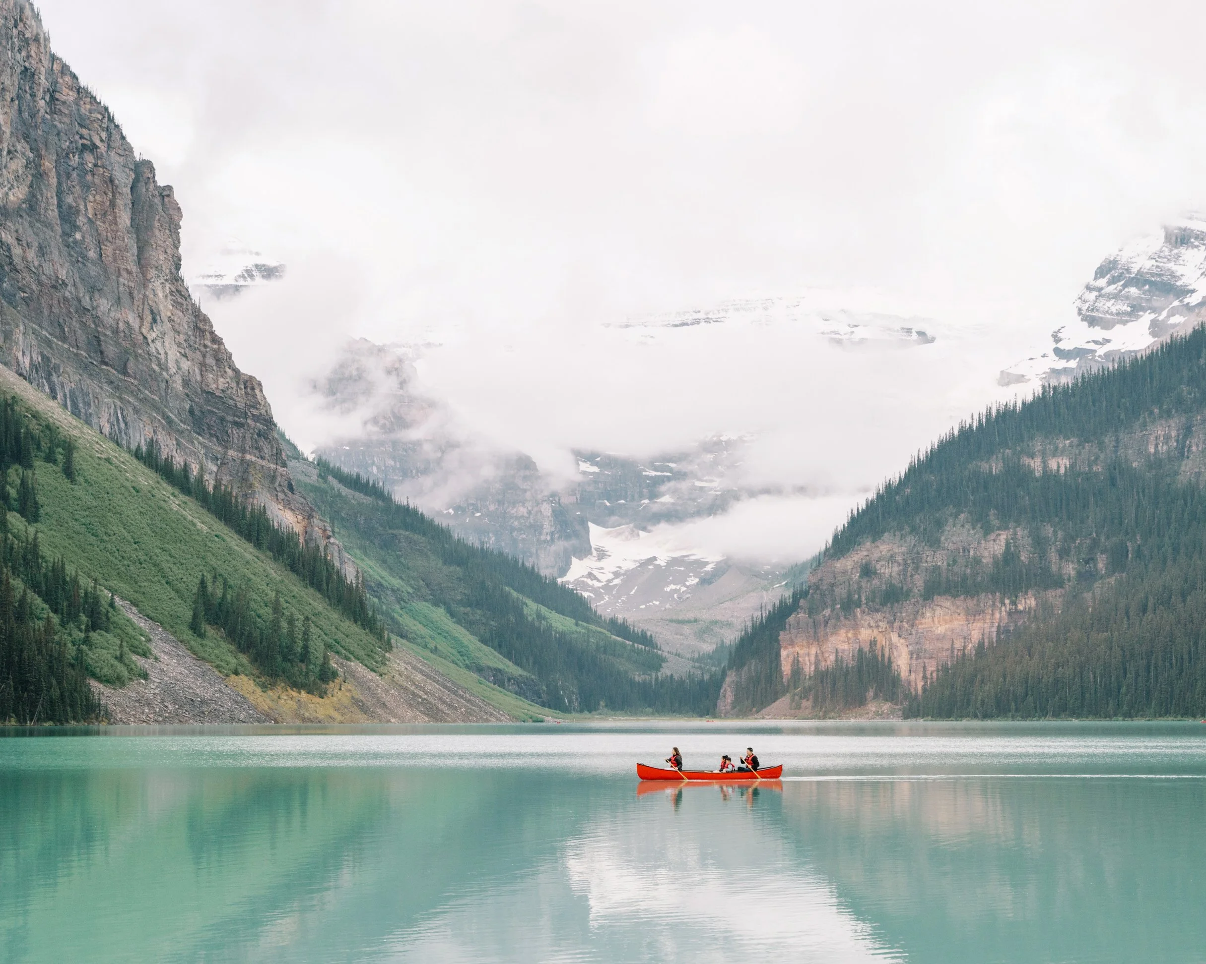 Family session at Lake Louise in canoe